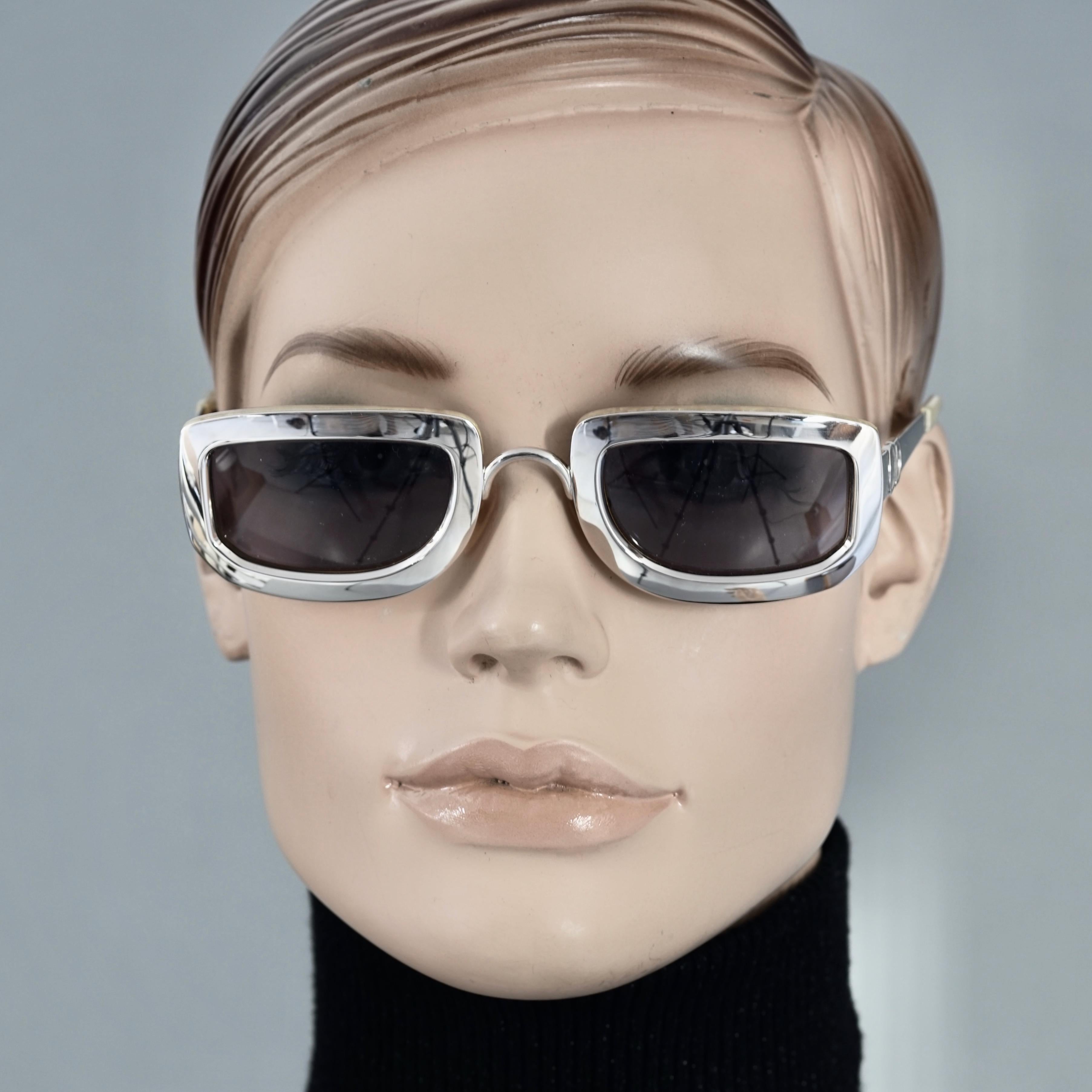 Vintage 1995 CHRISTIAN DIOR Silver Chrome Futuristic Sunglasses

Measurements:
Height: 1.53 inches (3.9 cm)
Horizontal Width: 5.03 inches (12.8 cm)
Arms: 4.80 inches (12.2 cm)

Features:
- 100% Authentic Vintage CHRISTIAN DIOR. 
- Rectangular silver