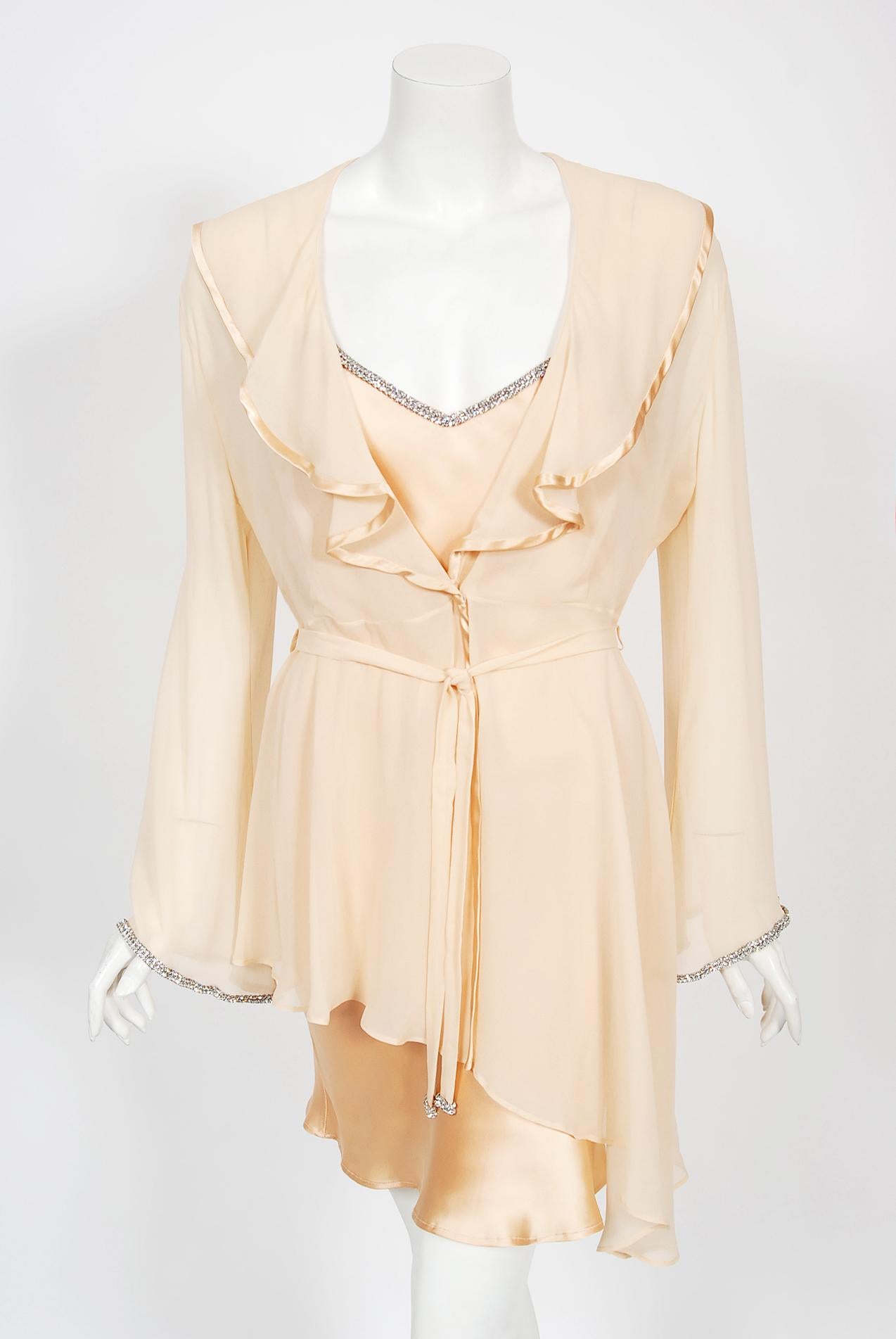 A beautiful Dolce & Gabbana peach rhinestone silk bias-cut slip dress and matching semi-sheer jacket dating back to their coveted 1995 spring/summer documented collection. As shown, the gorgeous Yasmeen Ghauri wears this ensemble down the runway.