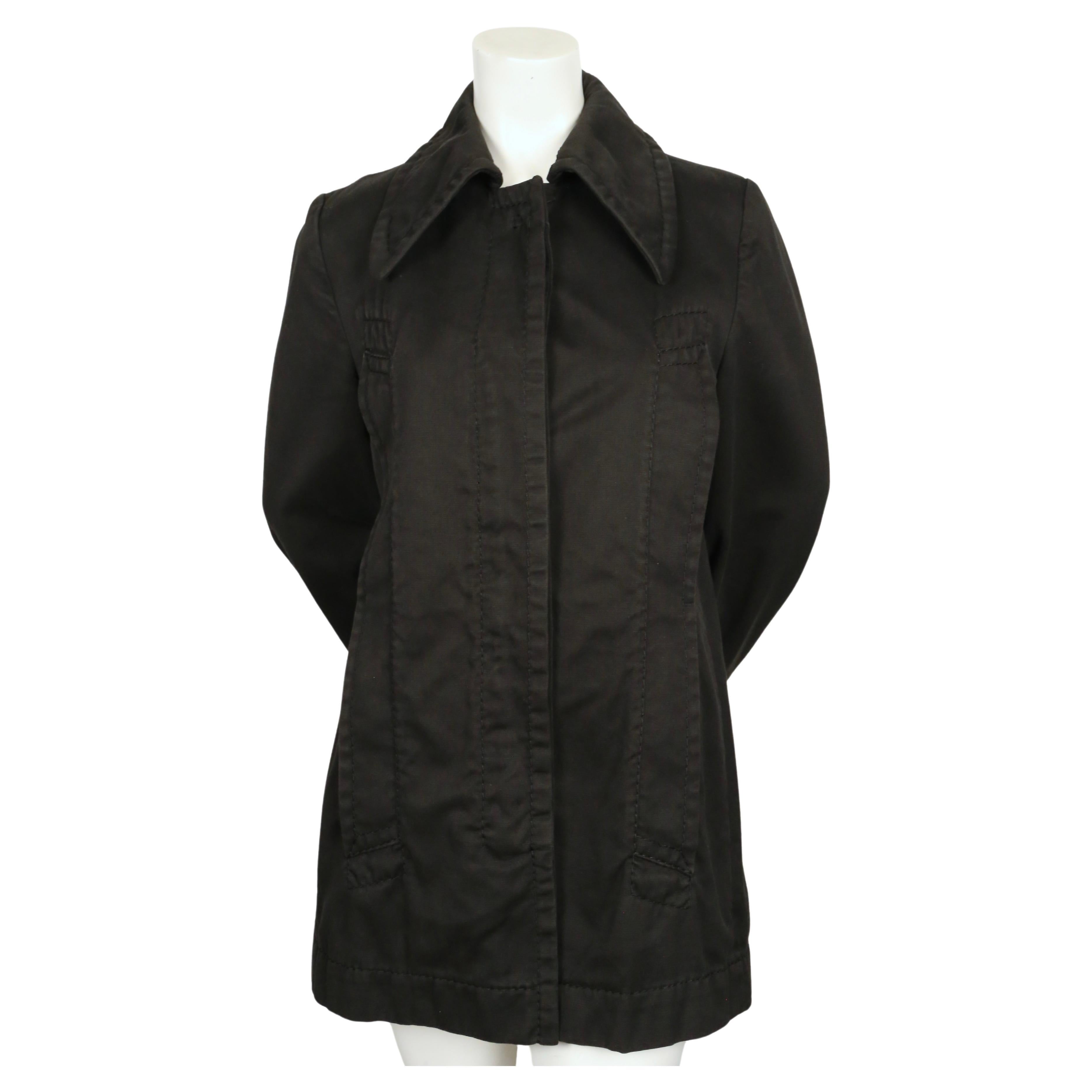 Black runway coat with oversized collar, elongated pockets and topstitching detail designed by Martin Margiela as seen on the fall 1996 runway. Labeled an Italian size 44. Approximate measurements: shoulder 15.5
