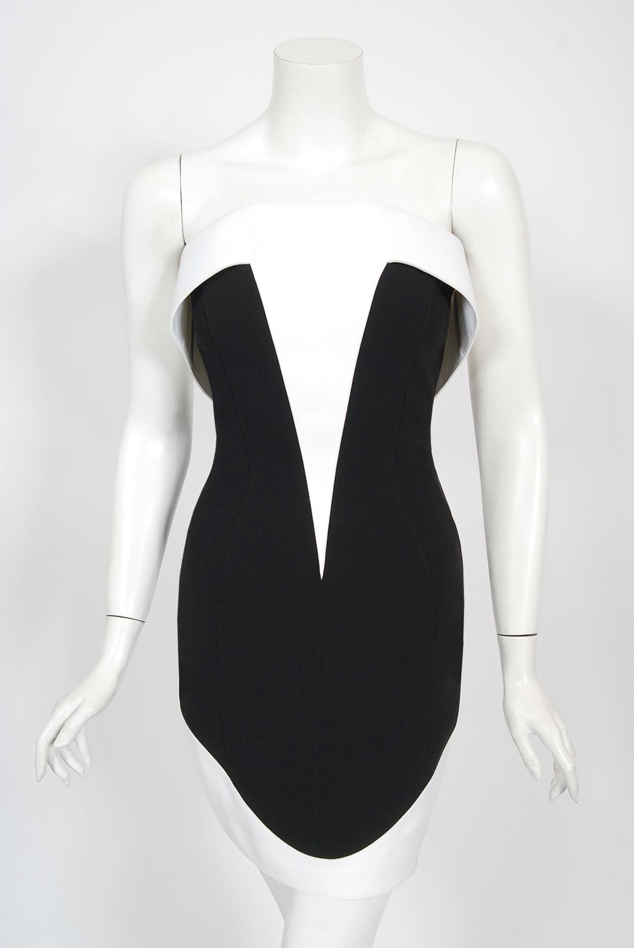 An iconic and truly timeless Thierry Mugler 1996 spring-summer collection strapless mini dress. This legendary French fashion designer is known for bold fashion and edgy, sometimes even campy, theatricality. Though Mugler stopped designing his