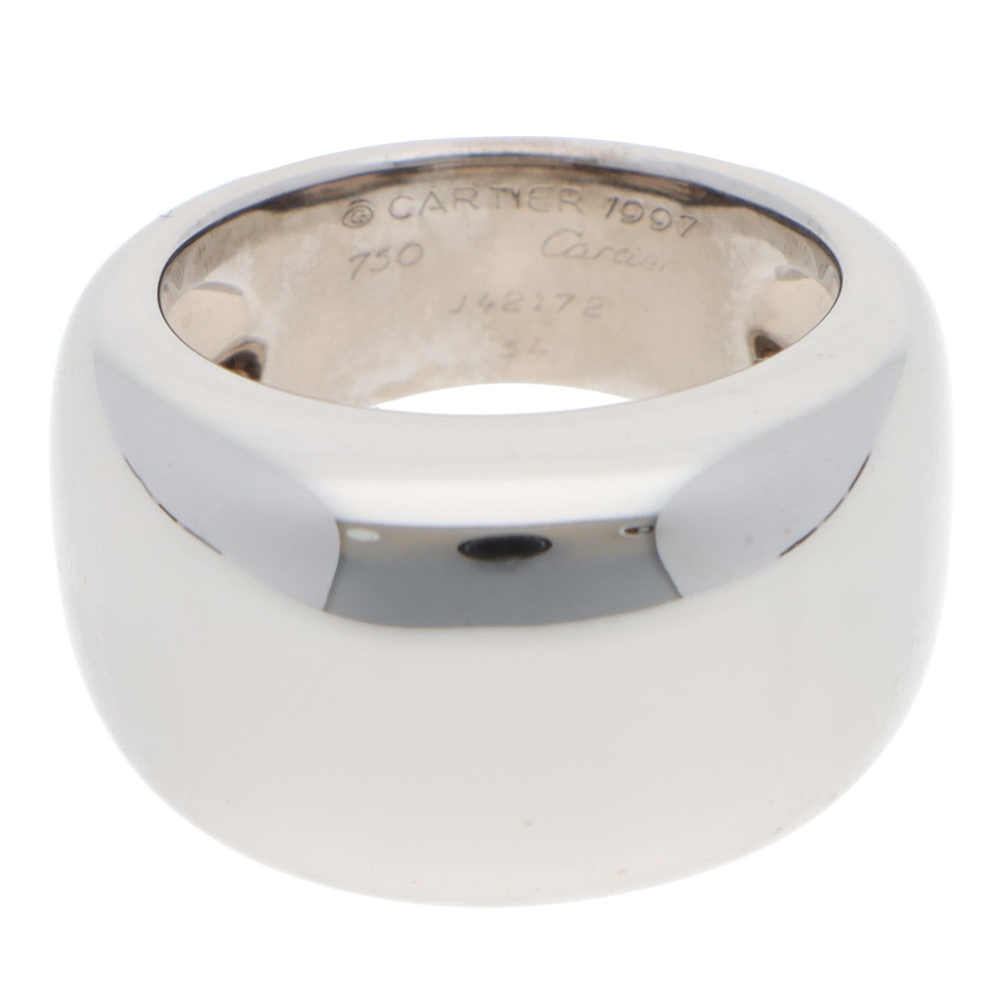 A beautiful vintage Cartier Nouvelle Vague ring set in 18k white gold from 1997.

From Cartier's discontinued collection, this piece is composed of a simple domed design, crafted from solid 18k white gold. The polished surface looks classic and