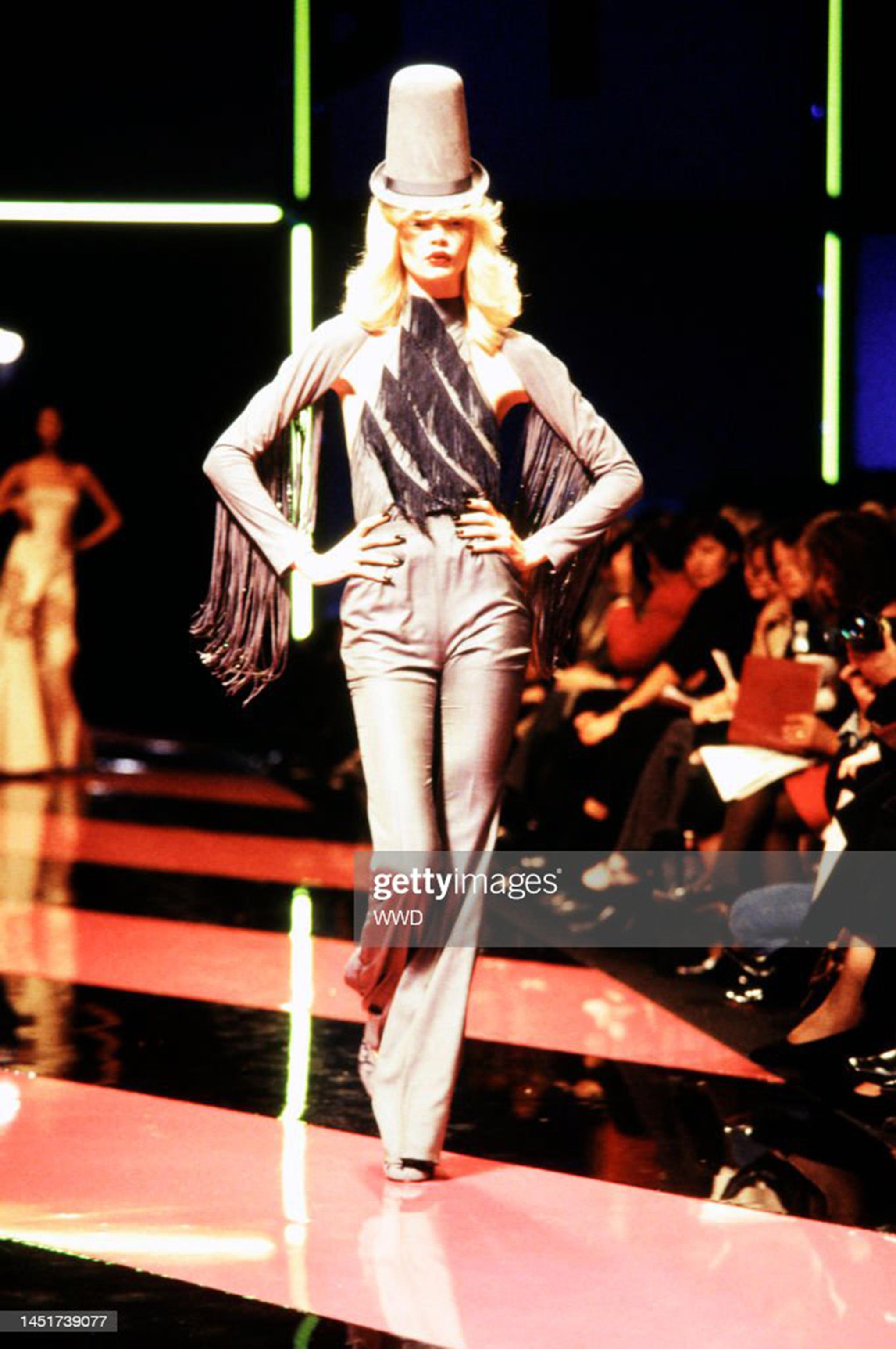 An incredibly chic and highly coveted Alexander McQueen for Givenchy blue-gray sharkskin silk ensemble dating back to his spring/summer 1998 documented runway collection. Shown in Paris, this halter blouse and matching pants were modeled by