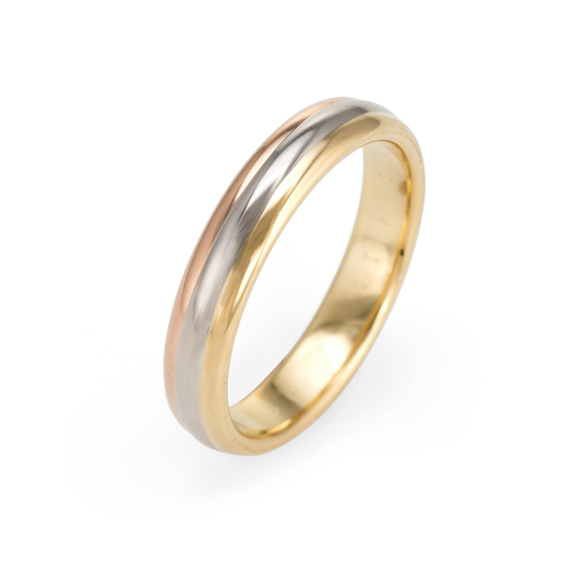 Cartier tri-gold ring, crafted in 18 karat yellow, white & rose gold.  

Circa 1998 the ring is a retired piece and no longer available for sale at retail.

The ring is in excellent condition and was recently professionally cleaned and polished. No