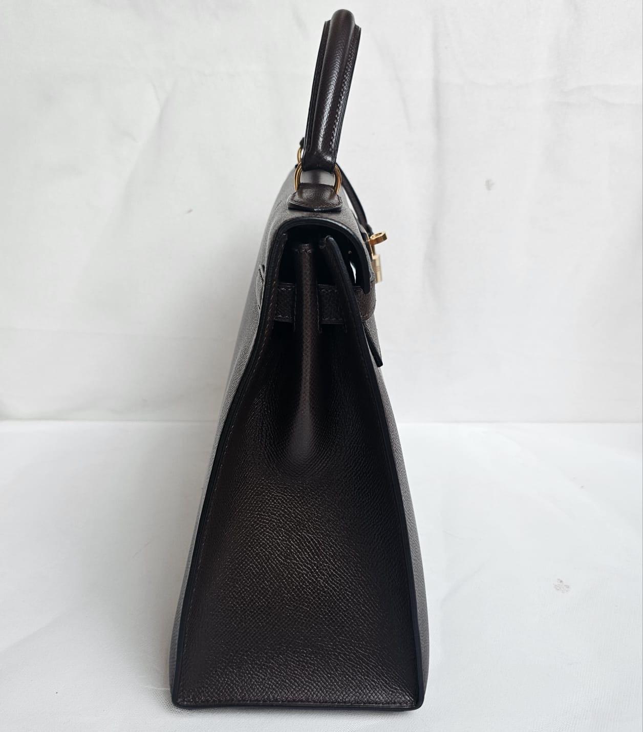 Vintage Hermes Kelly 32 in Cacao with gold hardware. Overall in very good vintage condition. Few faint scratch marks, but not significant. Lisse leather resembles current epsom leather. The color looks like black but shows dark brown tint under