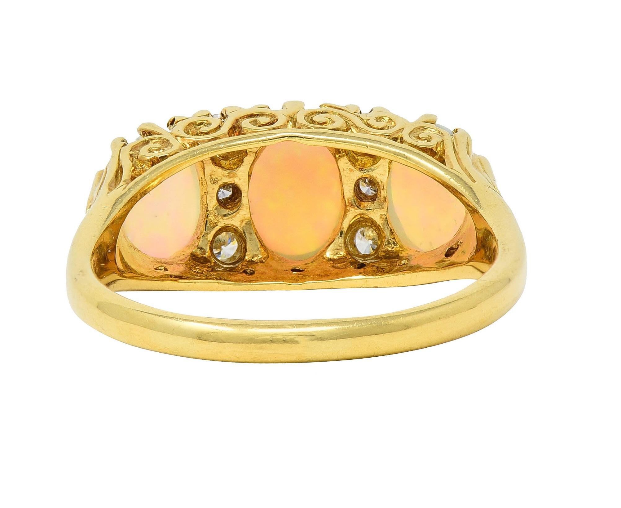 Vintage 1998 Opal Diamond 18 Karat Gold Scrolling Three Stone Ring In Excellent Condition For Sale In Philadelphia, PA