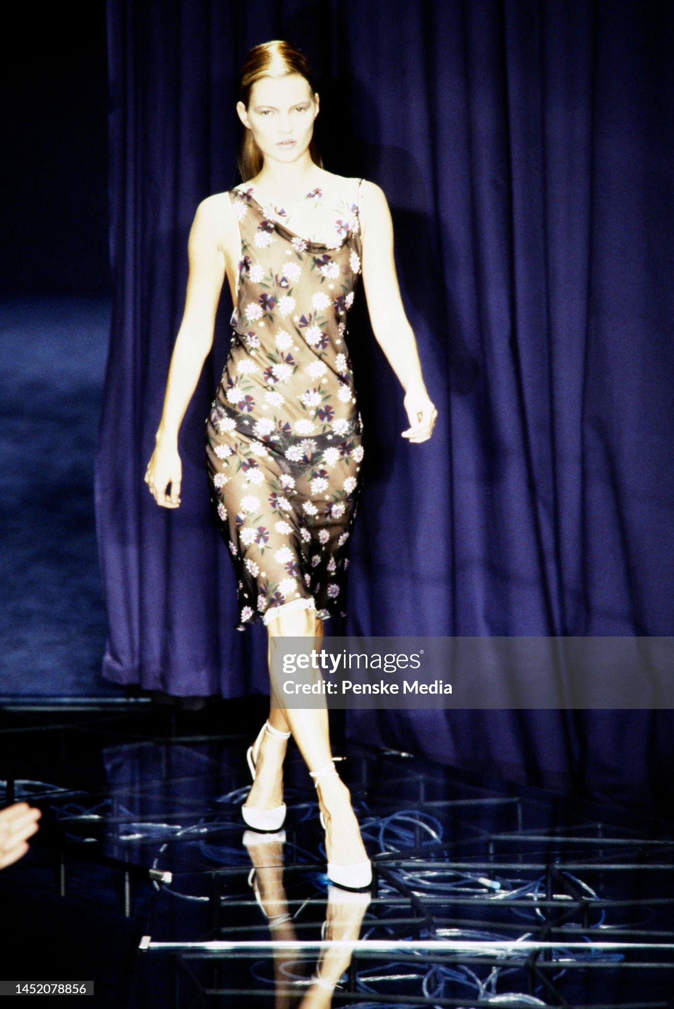 An incredibly chic and well documented Gianni Versace sheer double layered floral slip dress dating back to Donatella Versace's iconic 1998 spring-summer collection. Not only was this Donatella's debut collection but this rare dress was also modeled