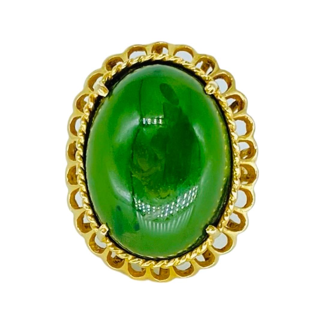 Vintage 19mm Green Jade Cabochon Cocktail Ring 14k Gold. Large Jade gemstone measuring approx 20mm. The ring is 25mm in height and weight 7.4 grams. The ring is a size 5.75