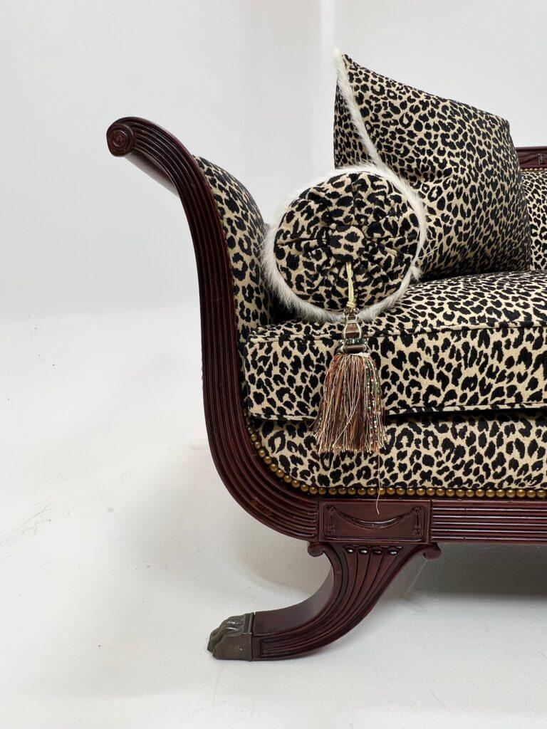 An undeniably beautiful and coveted antique 19th Century Duncan Phyfe sofa upholstered in a feline Onyx Merramec Barrow fabric. One of the brilliant minds of the colonial America, Phyfe’s signature style became representative of the New York and New