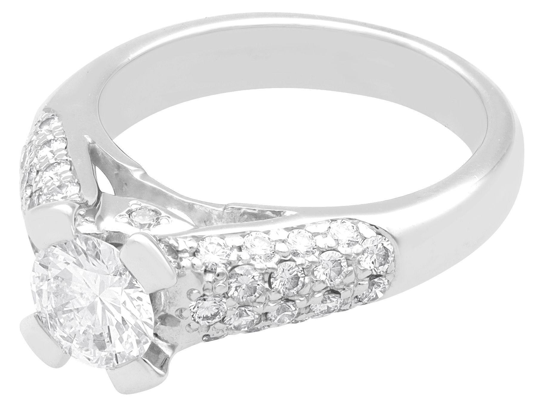 A stunning, fine and impressive vintage 1 Carat (total) diamond and 18 Carat white gold solitaire ring; part of our diverse vintage diamond ring collection.

This stunning, fine and impressive vintage diamond ring has been crafted in 18k white