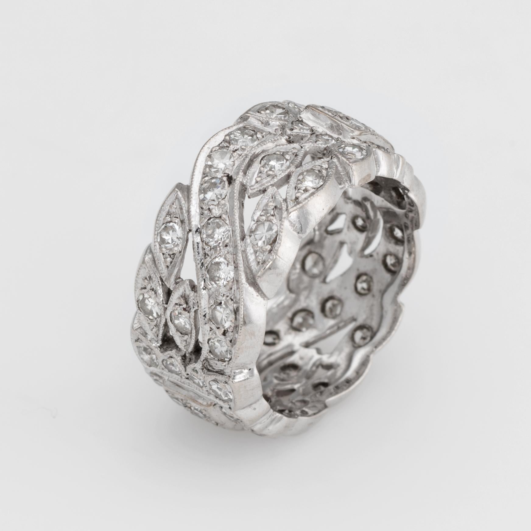 Finely detailed vintage wide band eternity ring (circa 1940s to 1950s), crafted in 14 karat white gold. 

Single and round brilliant cut diamonds total an estimated 1 carat (estimated at H-I color and VS2-SI1 clarity). 

The band features an