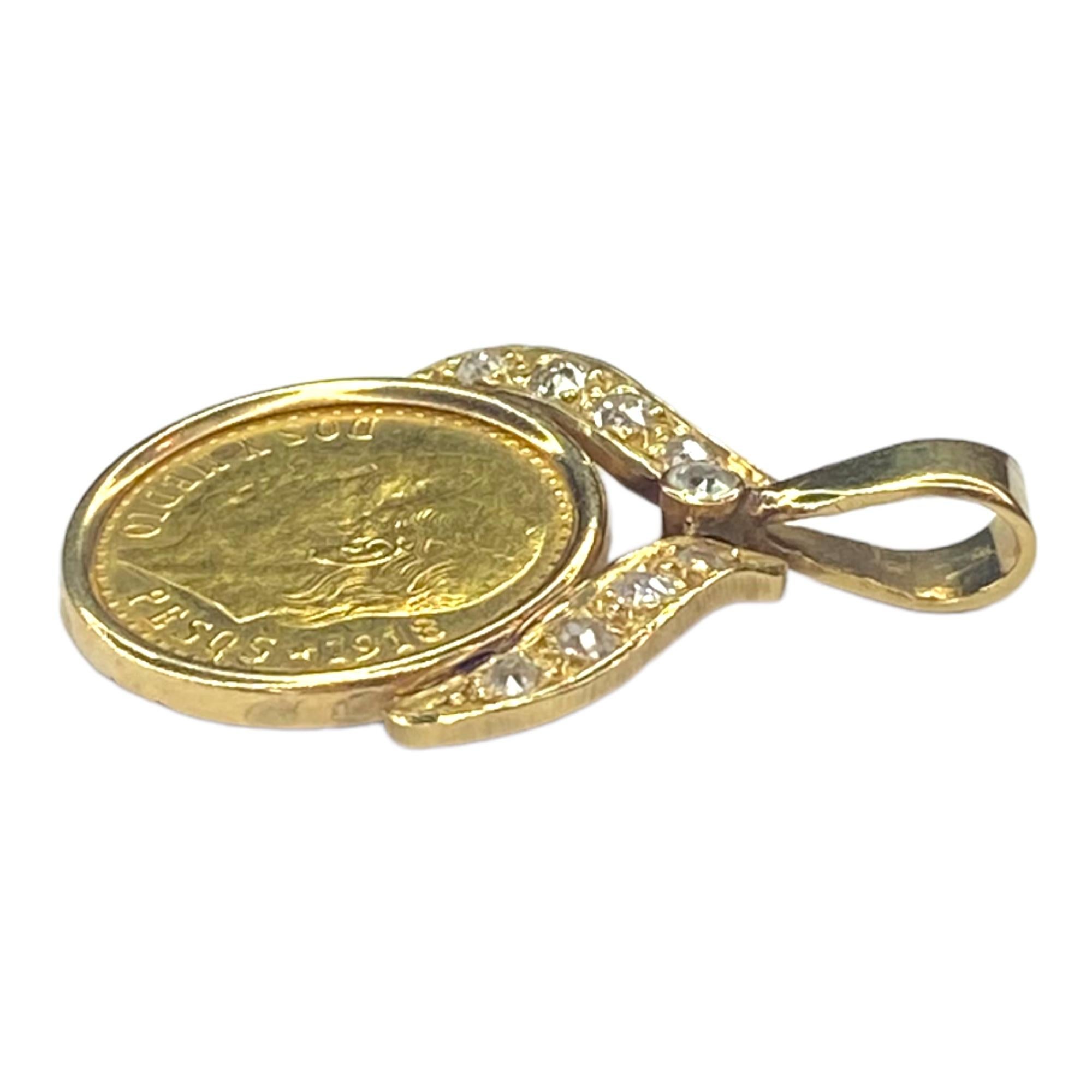 Vintage 2 1/2 Pesos gold coin set in a 14K yellow gold bezel, supported by diamond set gold ribbons and an eight millimeter long bail. 
9 old mine cut diamonds: 0.30ctw. Color: H-I, Clarity: SI1-I1
Coin:
- Contains 0.0603 oz of Gold.
- Obverse: The