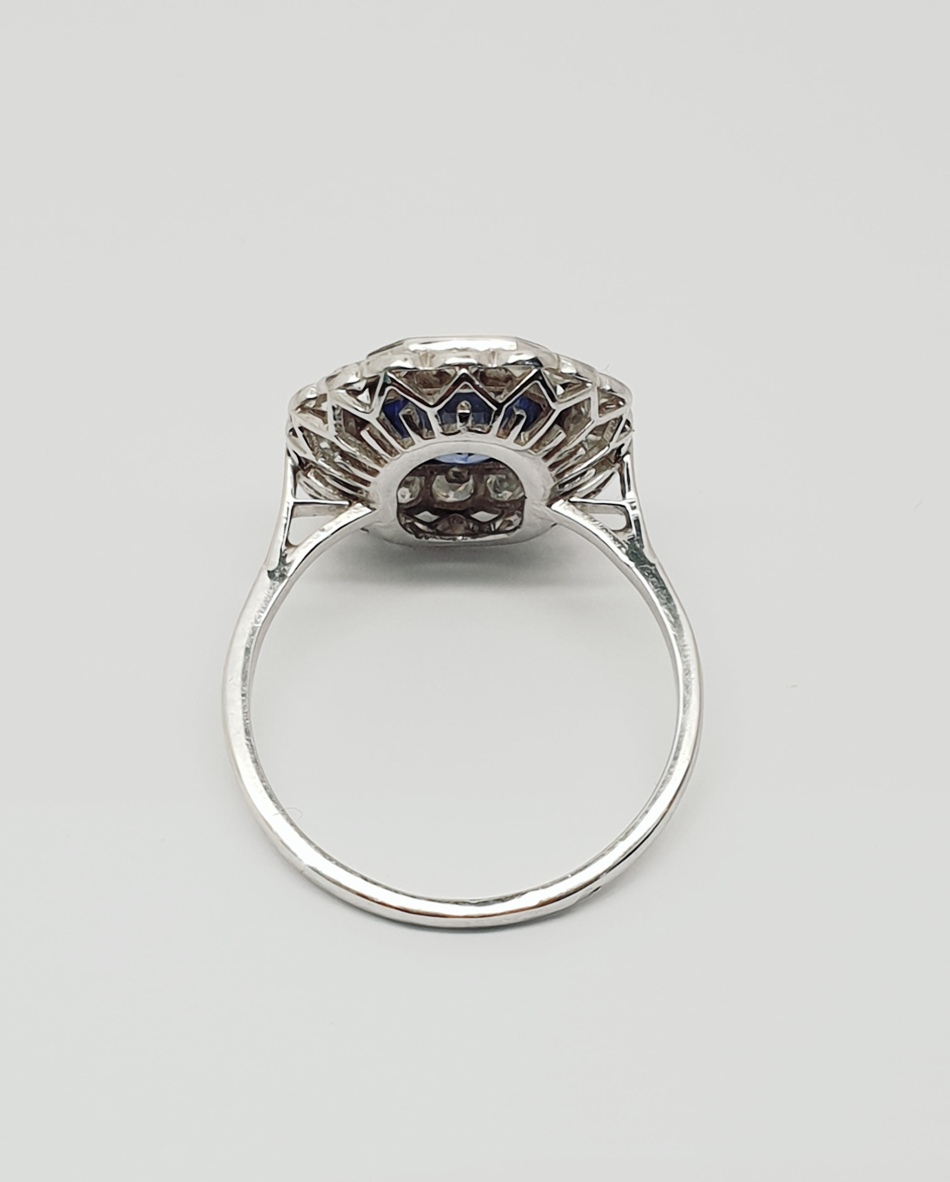 Offering a vintage french origin cluster sapphire diamond ring. The sapphire in the center just over 2 carat weight,heated Ceylon sapphire.
18 0.03 carat diamonds are set in the cluster. Total weight:0.54 carat. The ring is 18 carat white gold. Size