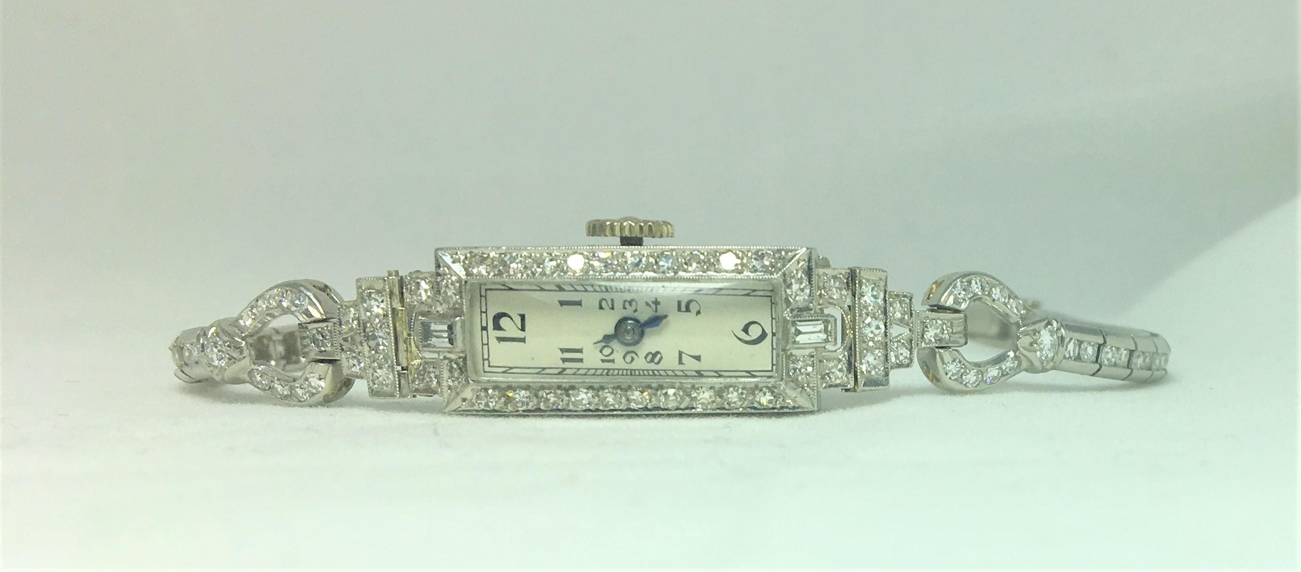 This watch has a slender, sleek design
Approximately 2 carats total diamond weight,
108 diamonds ranging in size from approximately .01 to .03 carat each
6 inches long
Platinum 
Watch is working with original parts.
Fold over clasp with second fold