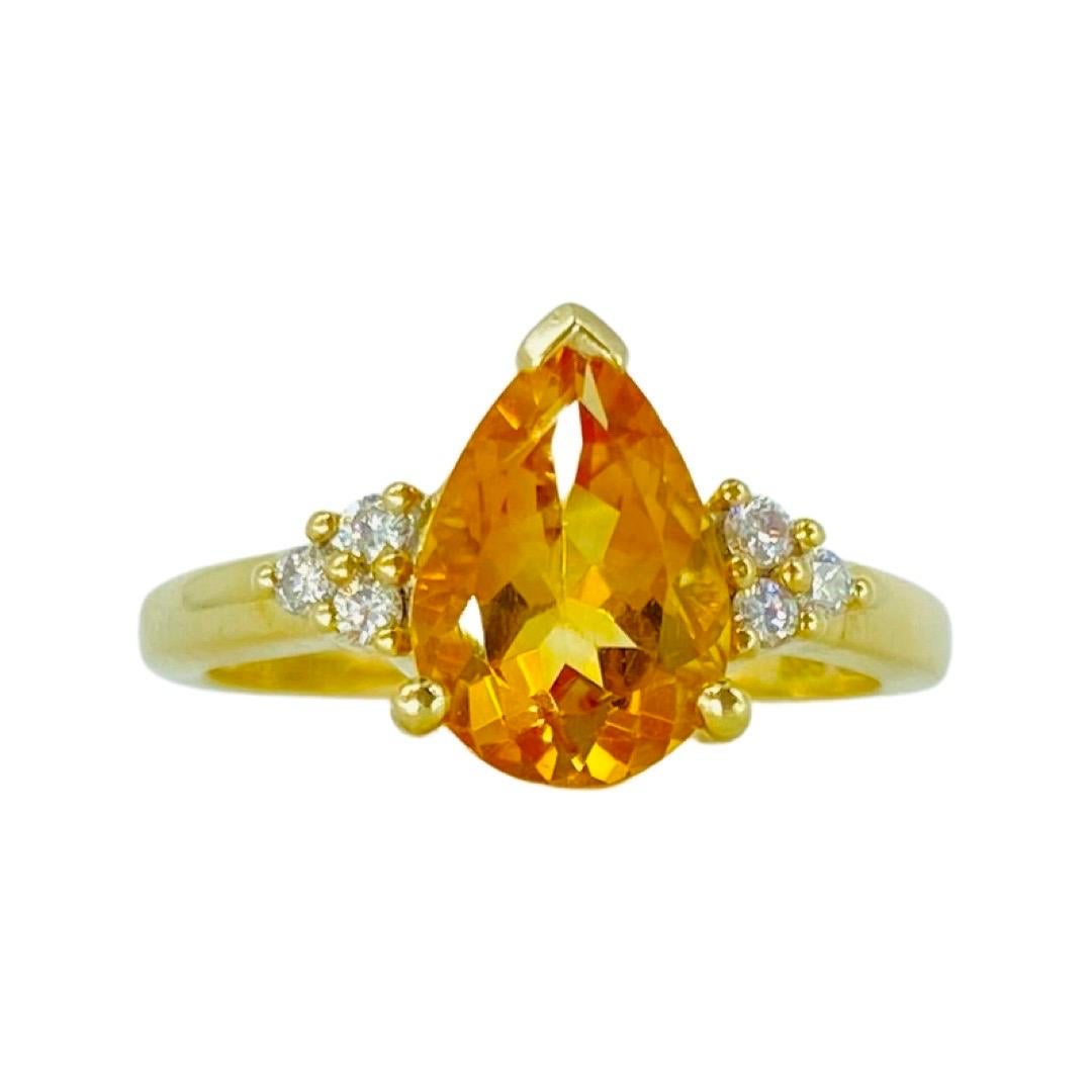 Vintage 2 Carat Pear Shape Citrine and Diamonds Engagement Ring 14k Gold. 
The ring features a center citrine gemstone weighing approx 2 carat and side diamonds weighing approx 0.09 total carat weight. The ring weights 3 grams and is made in 14