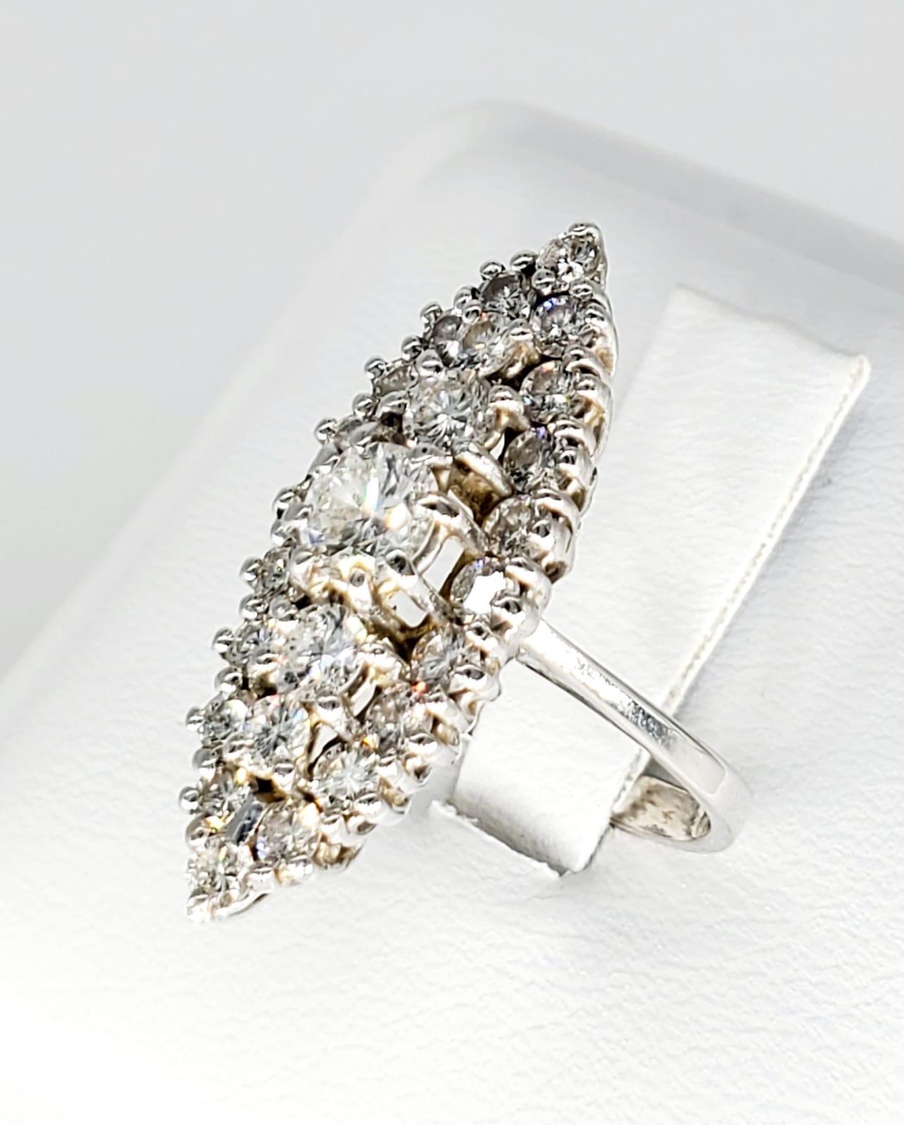 Vintage 2 Carats Diamonds Cluster Cocktail Ring 18k White Gold. The beauty in the ring is just unbelievable. The diamonds are VS clarity and very white. There is a total of 2 carats diamonds. 
Caution: you will fall in love with this ring!
Size: