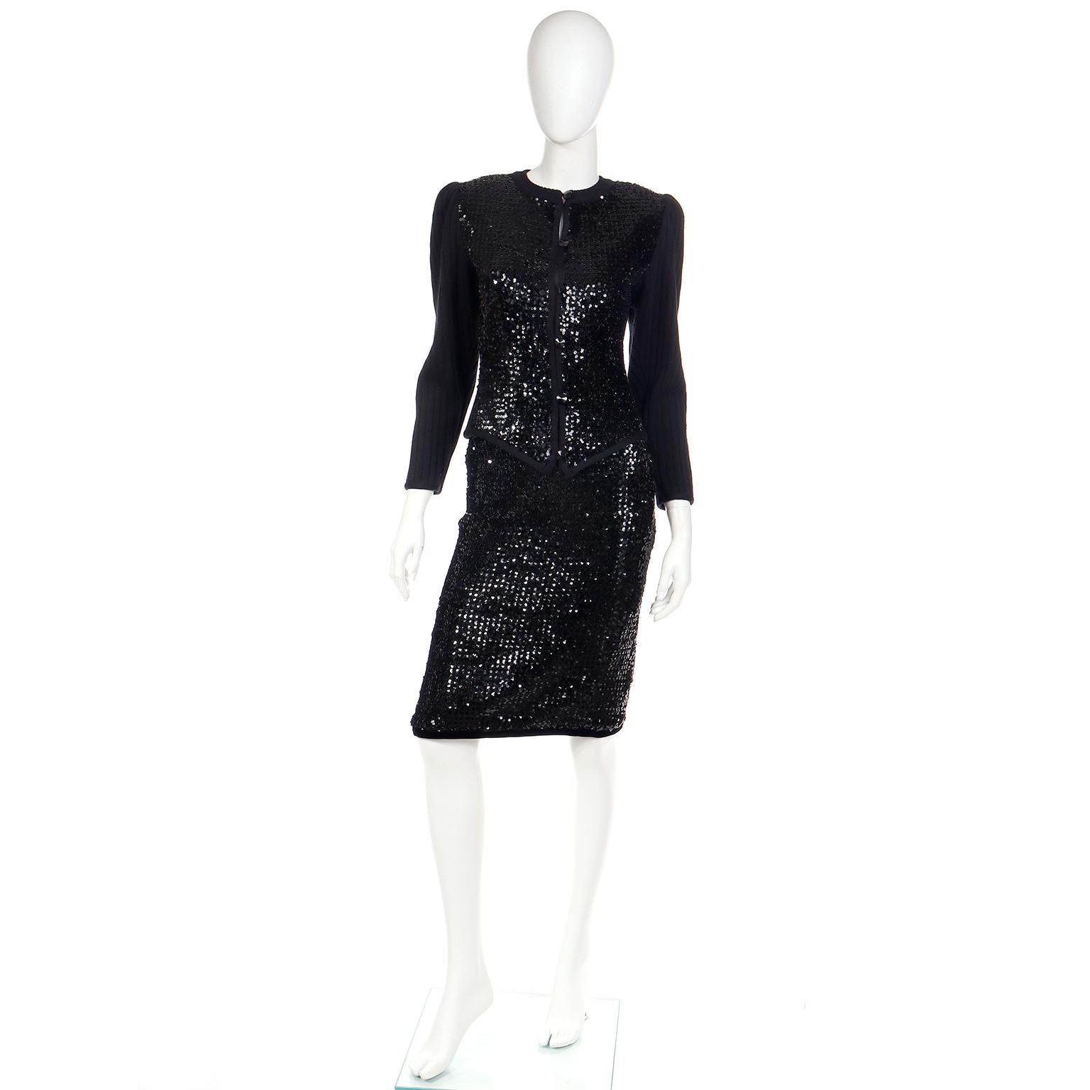 This is a really versatile 1980's Yves Saint Laurent vintage knit skirt suit with shimmering black sequins. This evening dress alternative set includes a button front knit sequin sweater with a sequin covered skirt.

The cardigan crew neck sweater