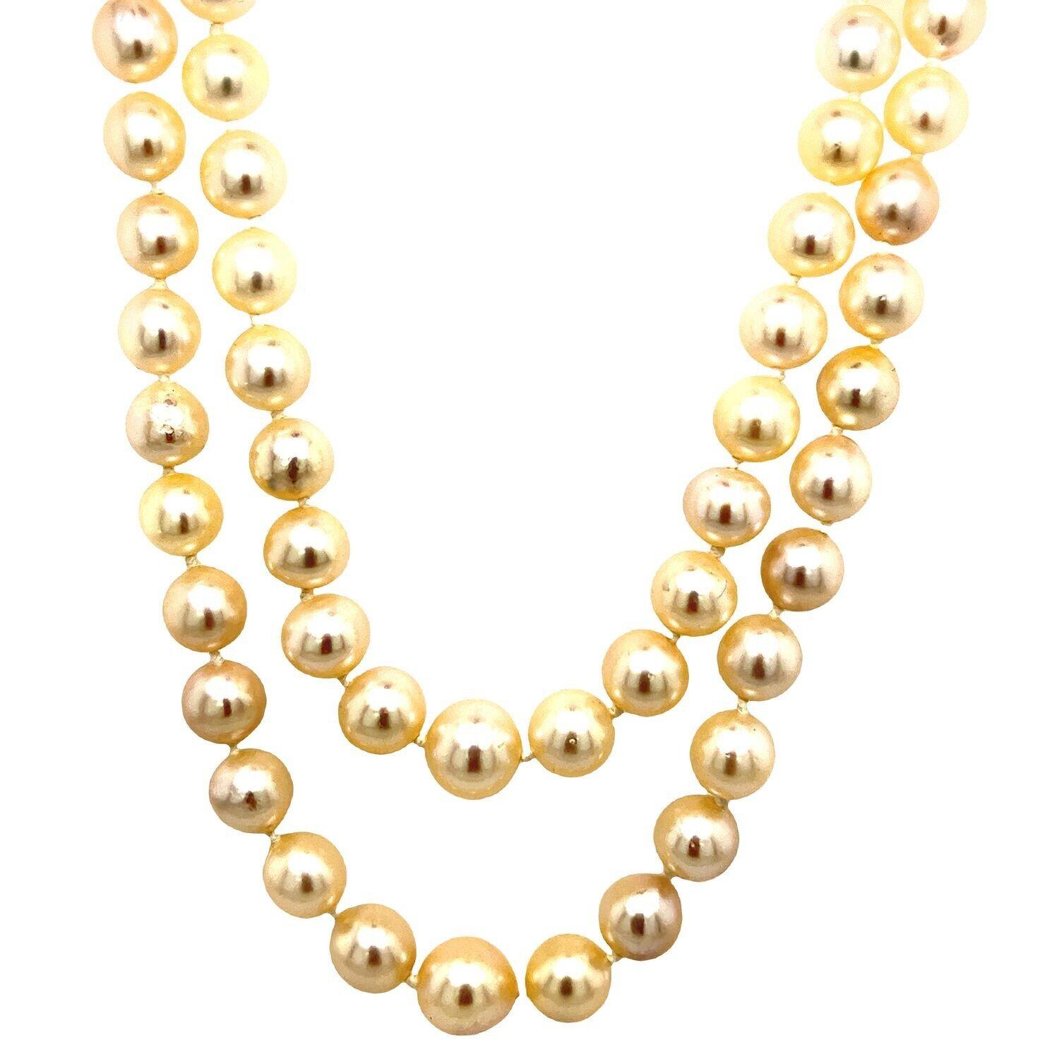 This vintage 2-row 6.8mm cultured pearl necklace is set with a 925 Silver clasp with white spinel gemstones. The total length is 18