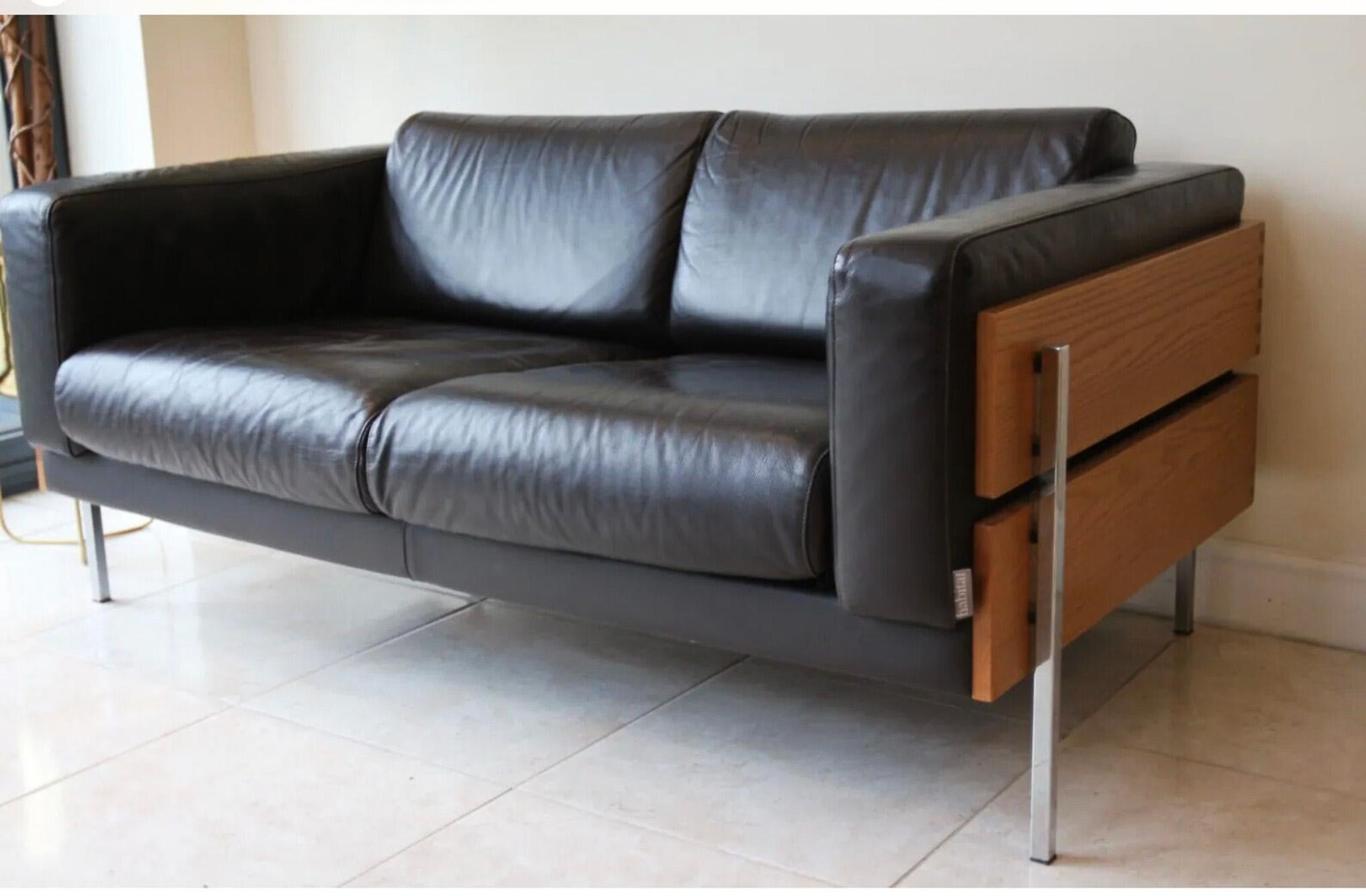 A vintage Habitat sofa designed by Robin Day originally manufactured for Hille.

This vintage dark brown leather sofa is perfect for adding a touch of character to your living space.

Crafted from high-quality materials, this two-seater sofa is