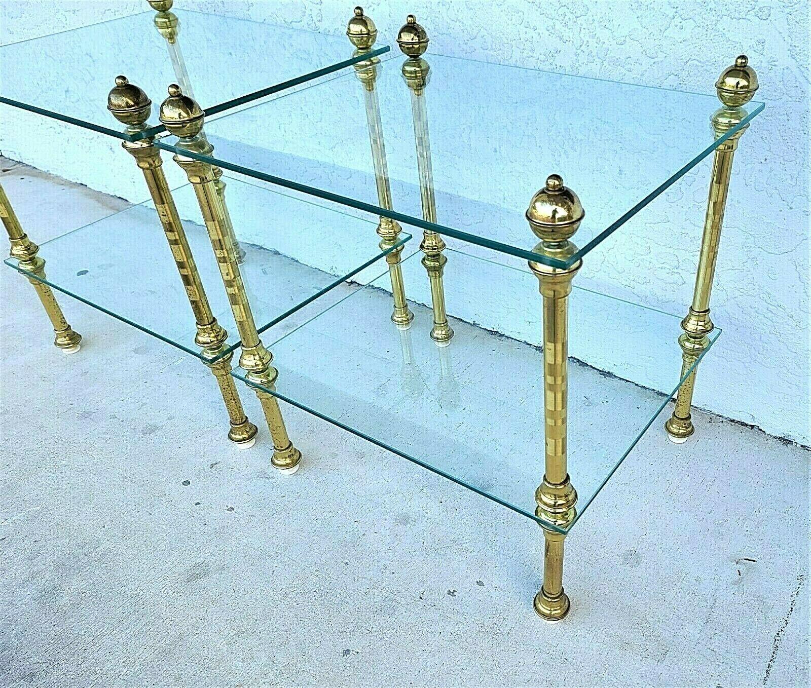 Offering one of our recent palm beach estate fine furniture acquisitions of a
Vintage pair of 2 tier brass & glass side end tables nightstands
Each leg has an adjustable leveler

Approximate measurements in Inches
23,5