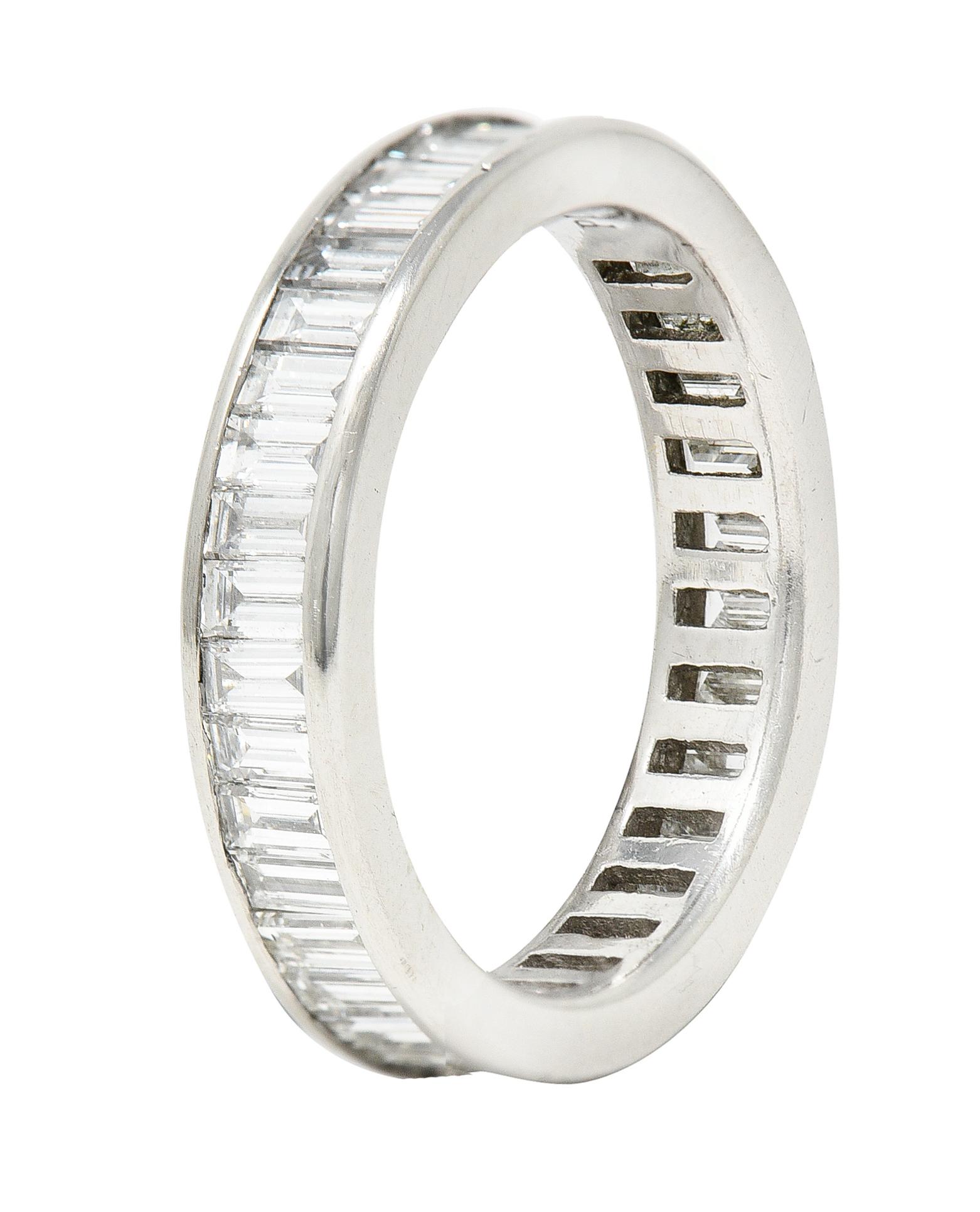 Band ring features baguette cut diamonds channel set fully around. Weighing approximately 2.00 carat total - H color with VS2 clarity. With high polished platinum surround. Stamped for platinum. Circa: Late 20th century. Ring size: 5 and not