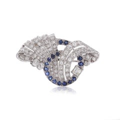 Vintage 2.00 ct. diamond and sapphire brooch in scrolling design