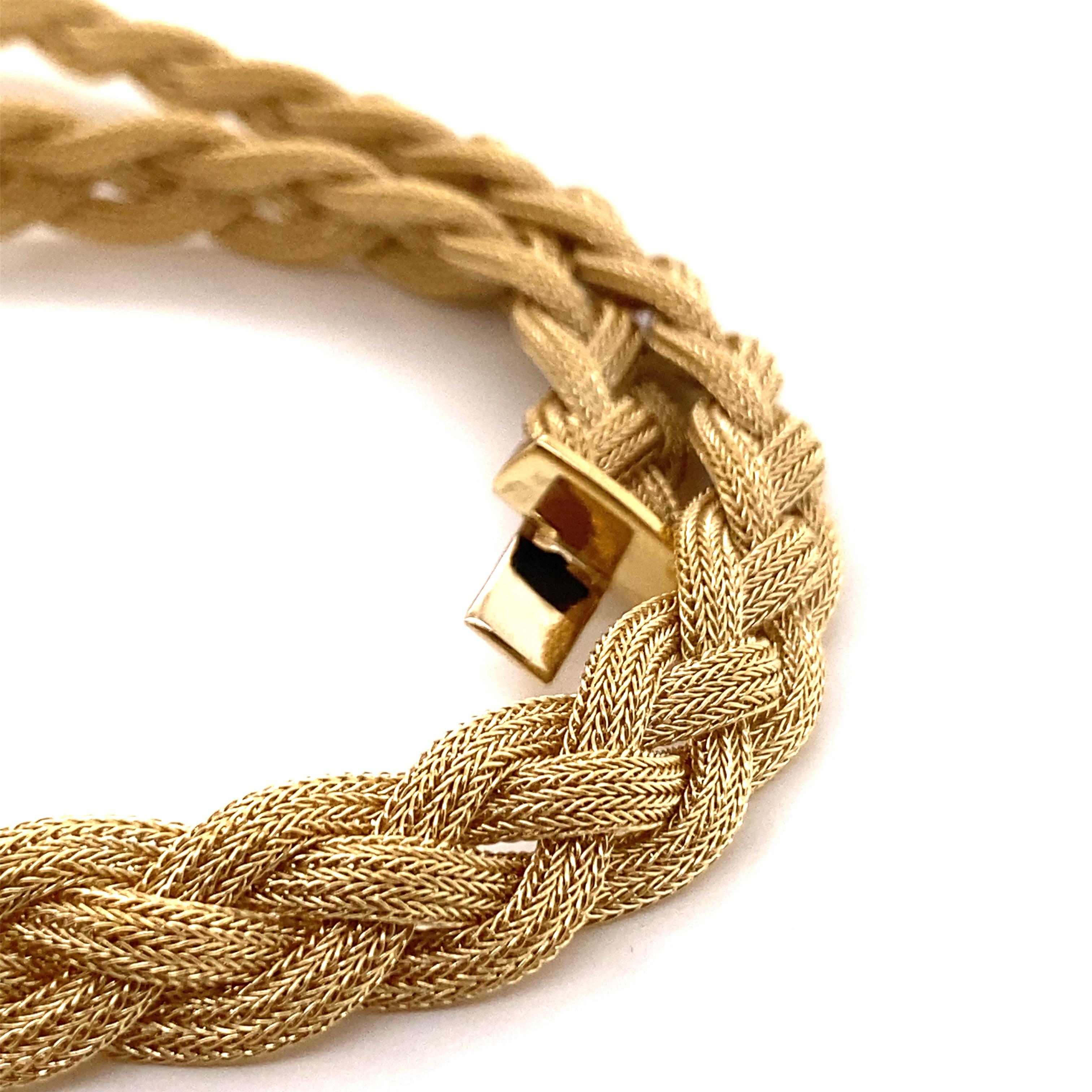 Vintage 2000’s 14K Yellow Gold Braided Necklace - The Italian made braided woven gold necklace is 10mm wide and 16 inches long. The necklace has a plunger clasp in the back with a figure 8 safety and weighs 38 grams.