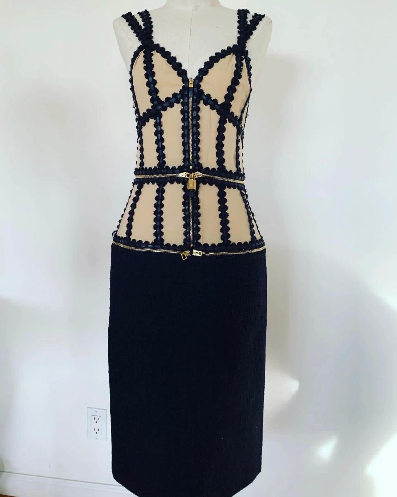 Vintage ALEXANDER MCQUEEN transformer dress. This rare and stunning early 2000s dress transforms from a sheath dress to a tank to a crop top corset style top. 

Leather trim, silk, and wool make this an edgy and delicate combination. Zippers and