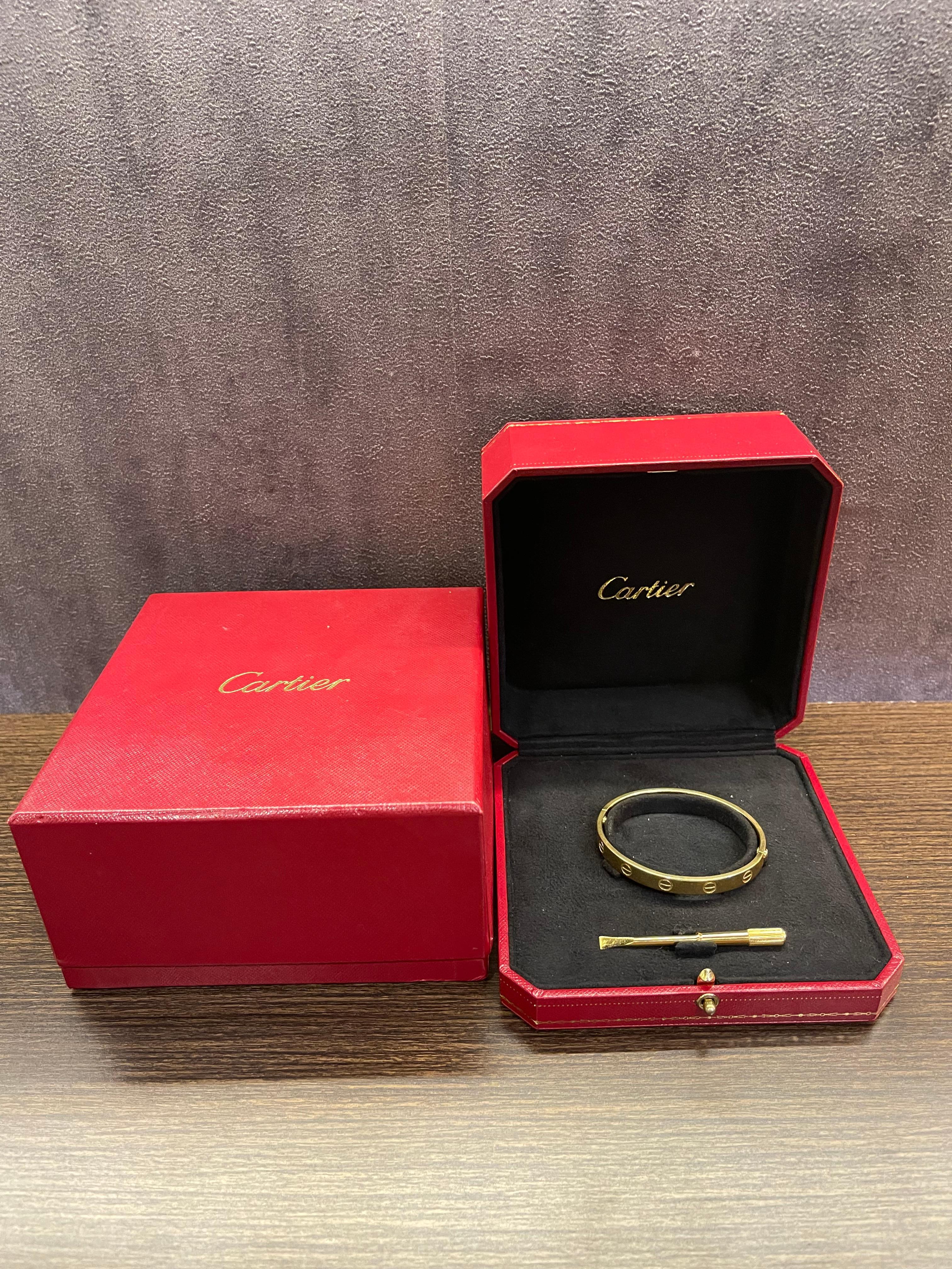 Beautiful vintage cartier love bracelet from early 2000s. Comes with its box and screwdriver. Item is missing its certificate, but has been through repair in Cartier official store in Japan and there is a repair receipt for it. Faint hairline