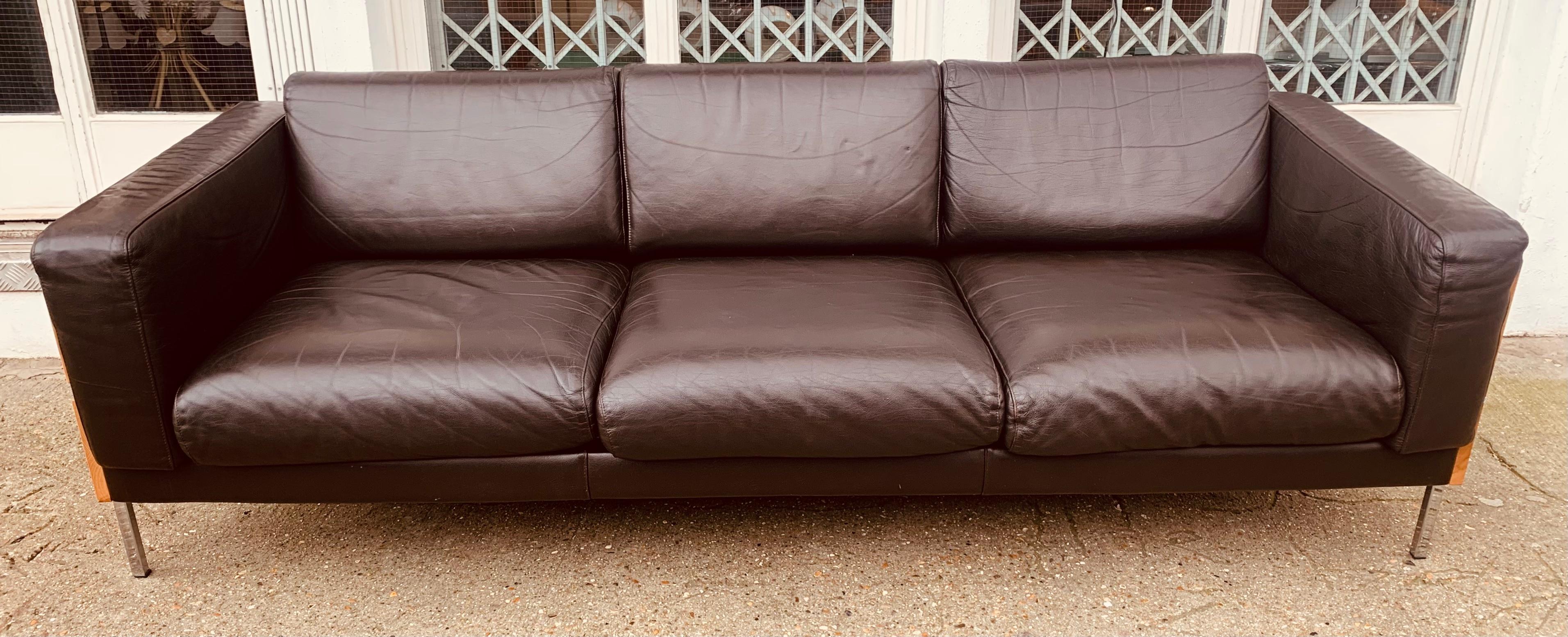 A classic and iconic 'Forum' three-seater sofa designed by Robin Day for Hille. It was originally designed in 1964 and later licensed and manufactured by Habitat in the early 2000s. The sofa is no longer available.

The soft and supple dark brown