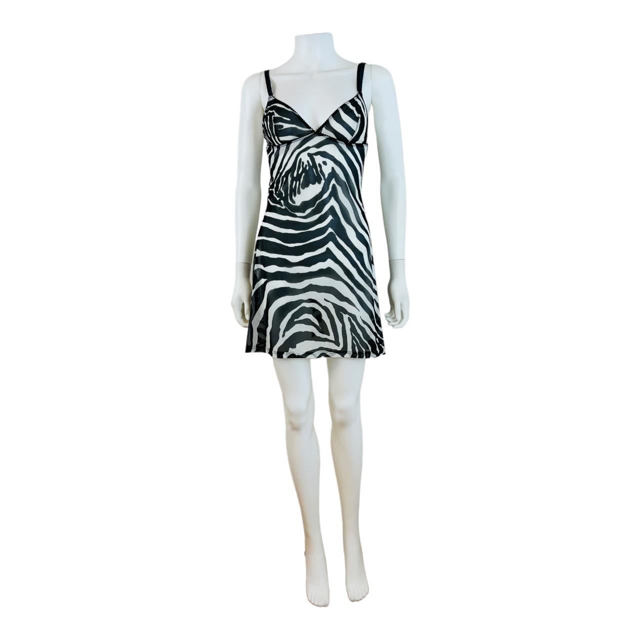 Beautiful Dolce & Gabbana intimo slip dress
Fitted bust cups
Adjustable bra style straps
Mesh zebra print fabric - nylon + elastin
Semi sheer mesh fabric
Unlined
Slips on overhead

Size not marked, fits like an XS/S, Measurements - Underarm to