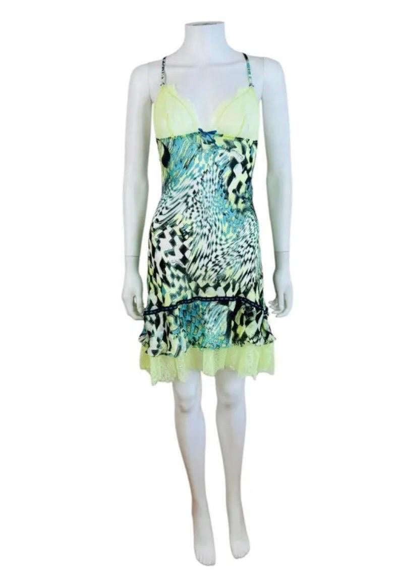 Vintage 2000s Roberto Cavalli dress
Geometric semi sheer silk fabric
Semi sheer Lace fabric at the bust
Thin adjustable shoulder straps criss cross at the upper back
Mini length
Ruffle hemline with additional ruffle lace hem
Unlined
Slips on