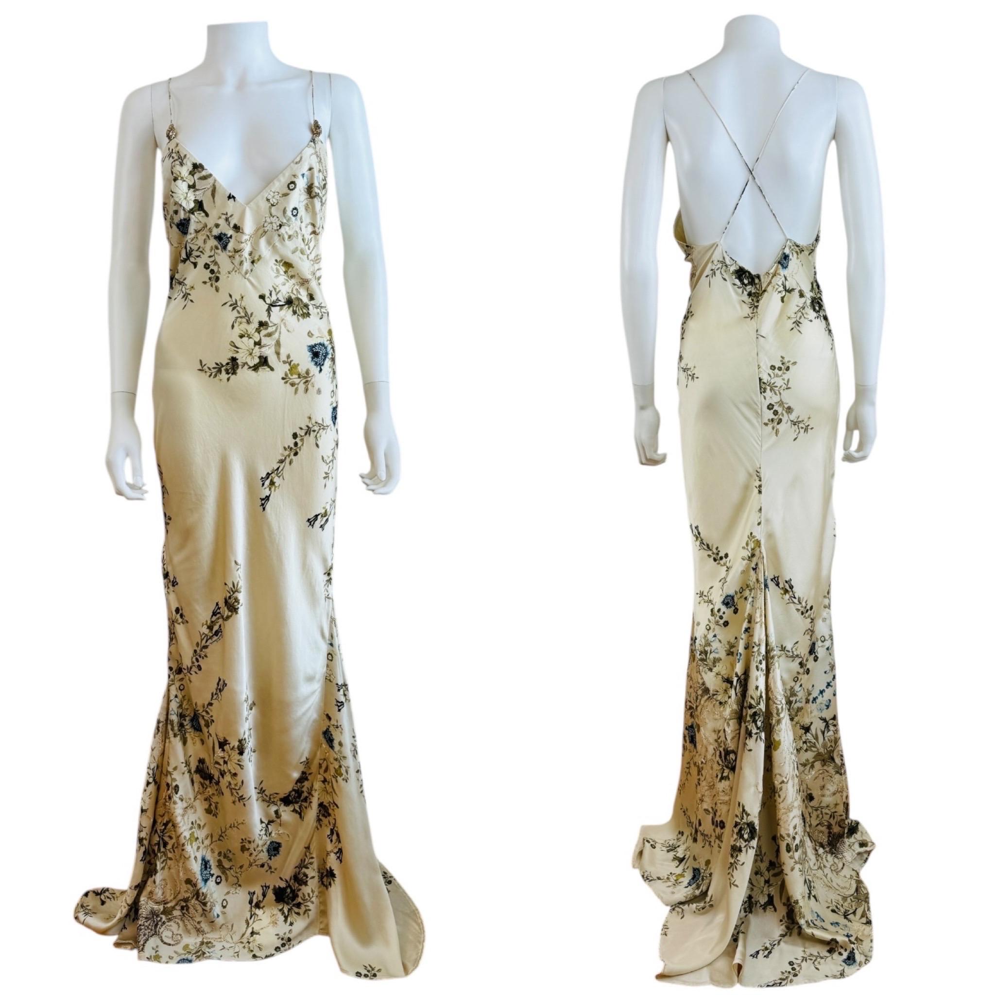 Early 2000s Vintage Roberto Cavalli Dress 
Cream silk with painted style delicate floral print
Thin shoulder straps with gold snake accents + rhinestone eyes
Deep V neckline
Bias cut mermaid style
Fitted  bodice with flared hem +