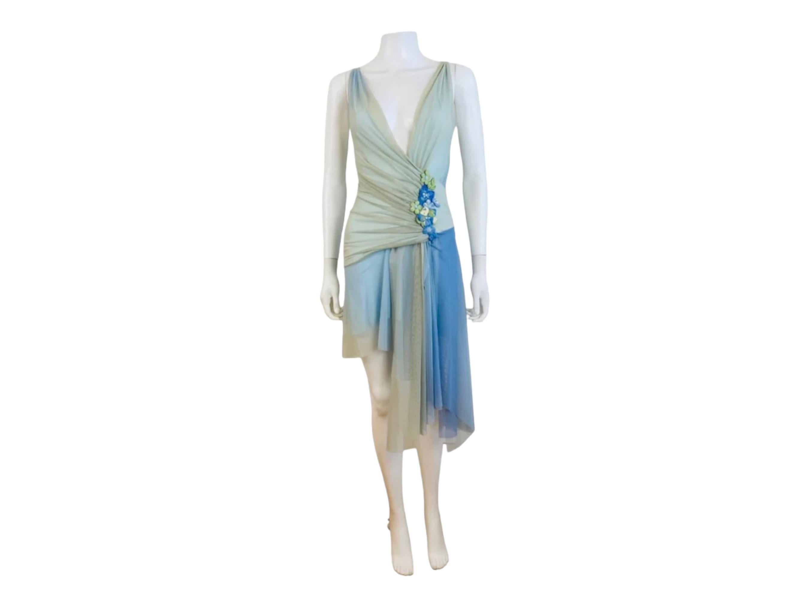 2000s Y2K Ema Savahl dress
Pale green + blue mesh fabric
Plunging neckline w/cross over details
Gathered fabric details on the bodice
Left hip detail with hand painted flowers + iridescent blue rhinestones
Asymmetrical hem
Mini + midi length
Lined