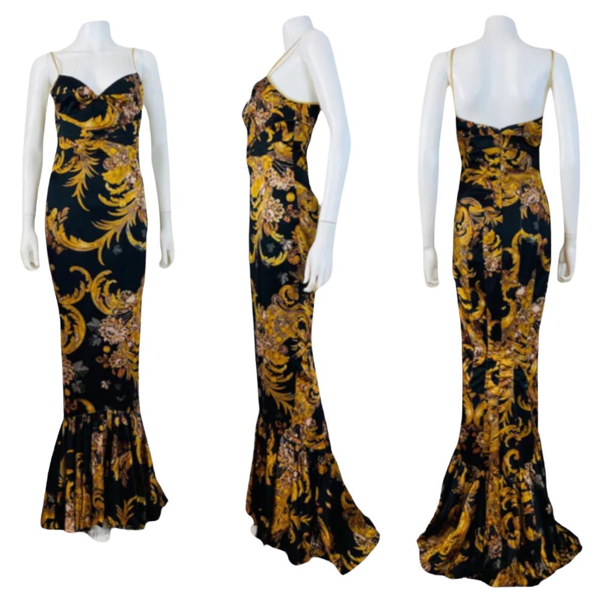 2000s Just Cavalli by Roberto Cavalli Satin Dress Gown
Beautiful baroque print stretch satin fabric
Thin metallic gold shoulder straps
Bras style fitted cup bust
Panel details on the bodice
Maxi length fitted skirt with flared mermaid hem
Open upper