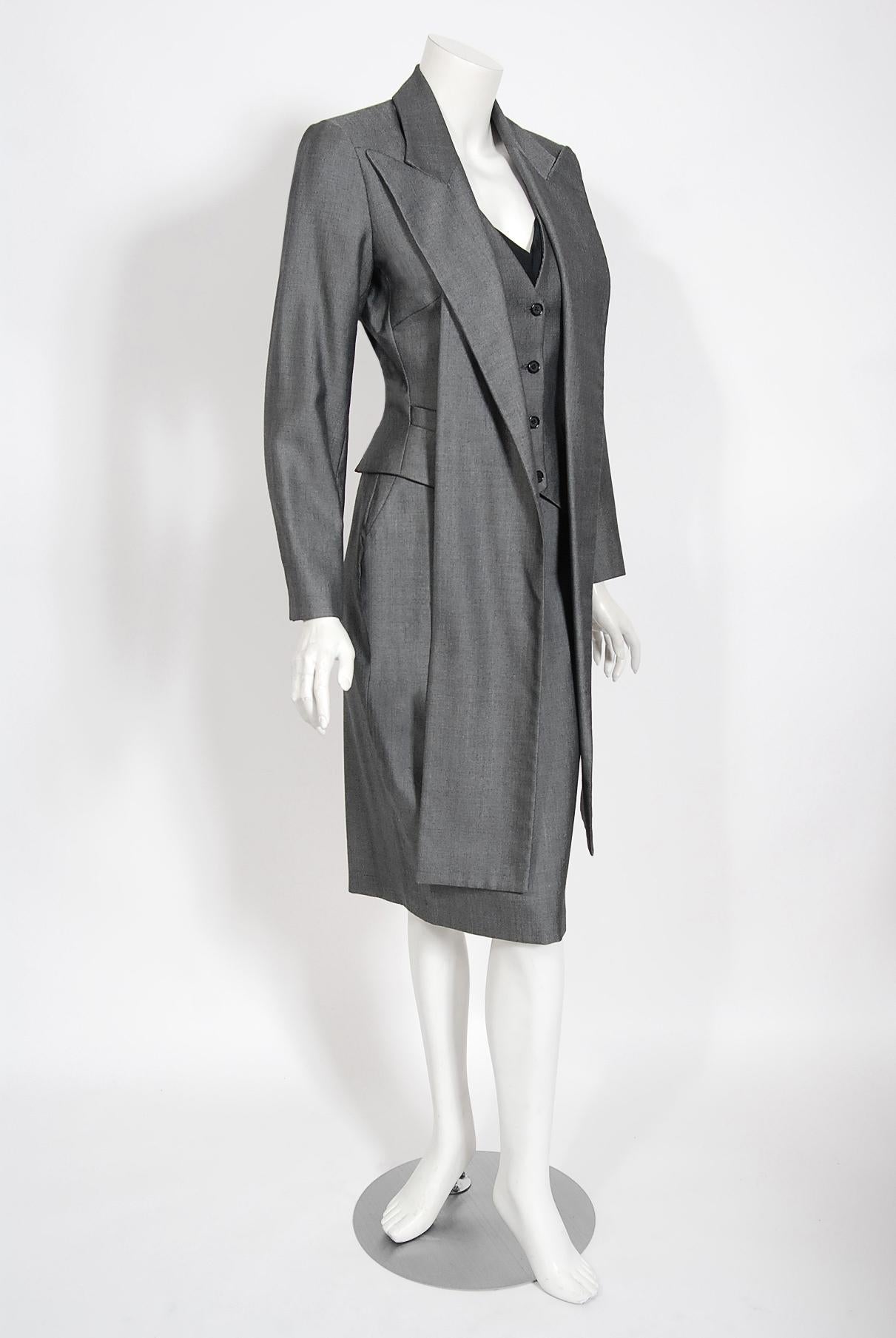 Breathtaking Alexander McQueen runway gray sharkskin wool hourglass dress with matching surrealist jacket dating back to his iconic 1997 spring-summer collection. As shown, this gorgeous ensemble is the commercial version of runway look 9. A black