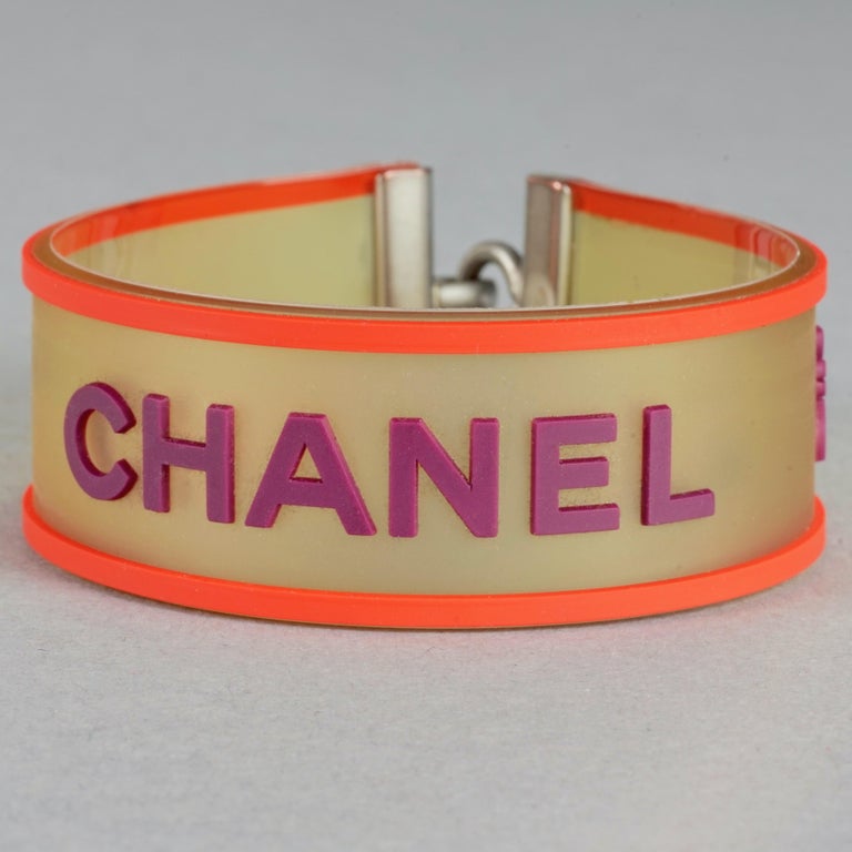 Vintage 2001 CHANEL Logo Camellia Orange Violet Rubber Cuff 