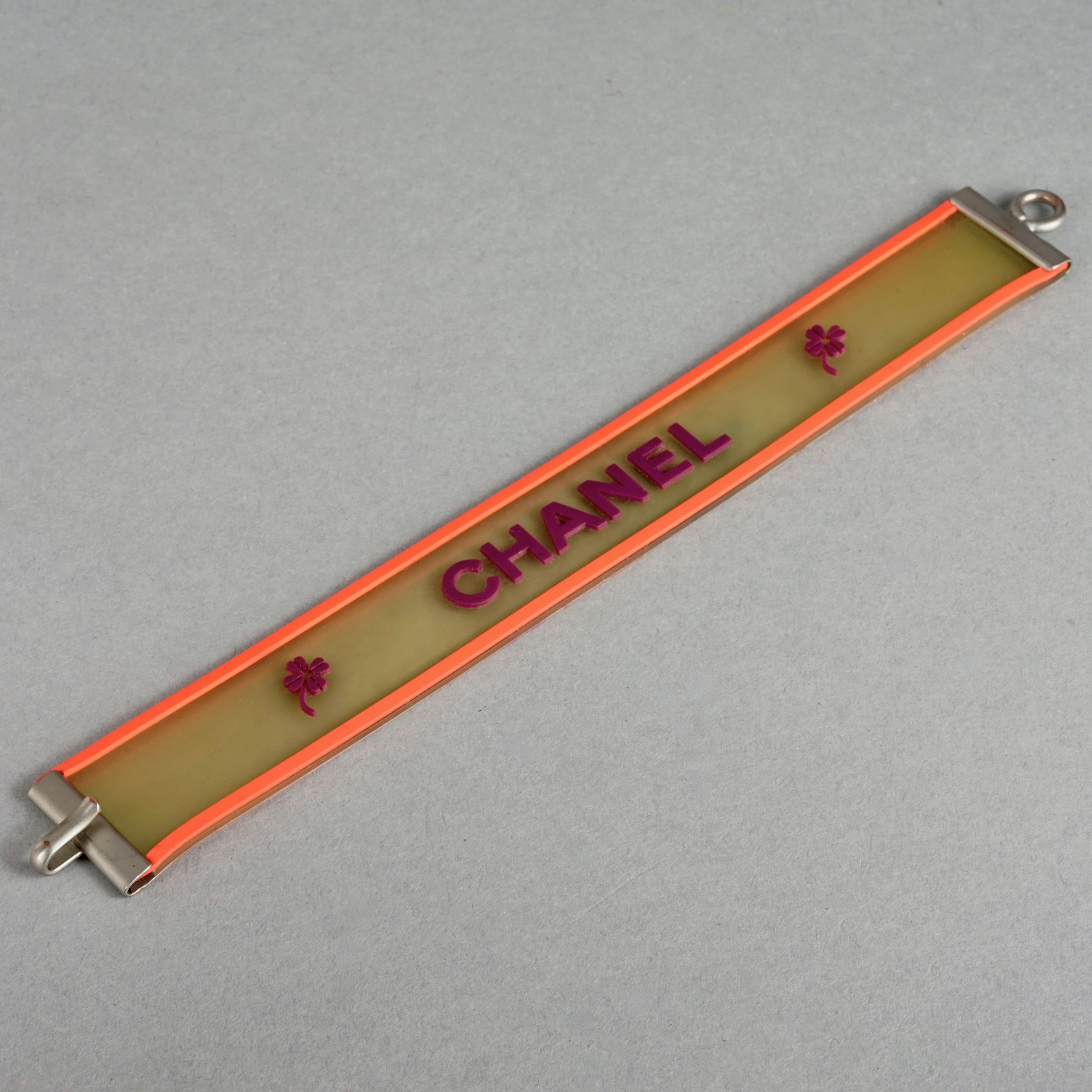 Women's Vintage 2001 CHANEL Logo Camellia Orange Violet Rubber Cuff Bracelet For Sale