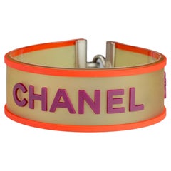 Vintage 2001 CHANEL Logo Camellia Orange Violet Rubber Cuff Bracelet