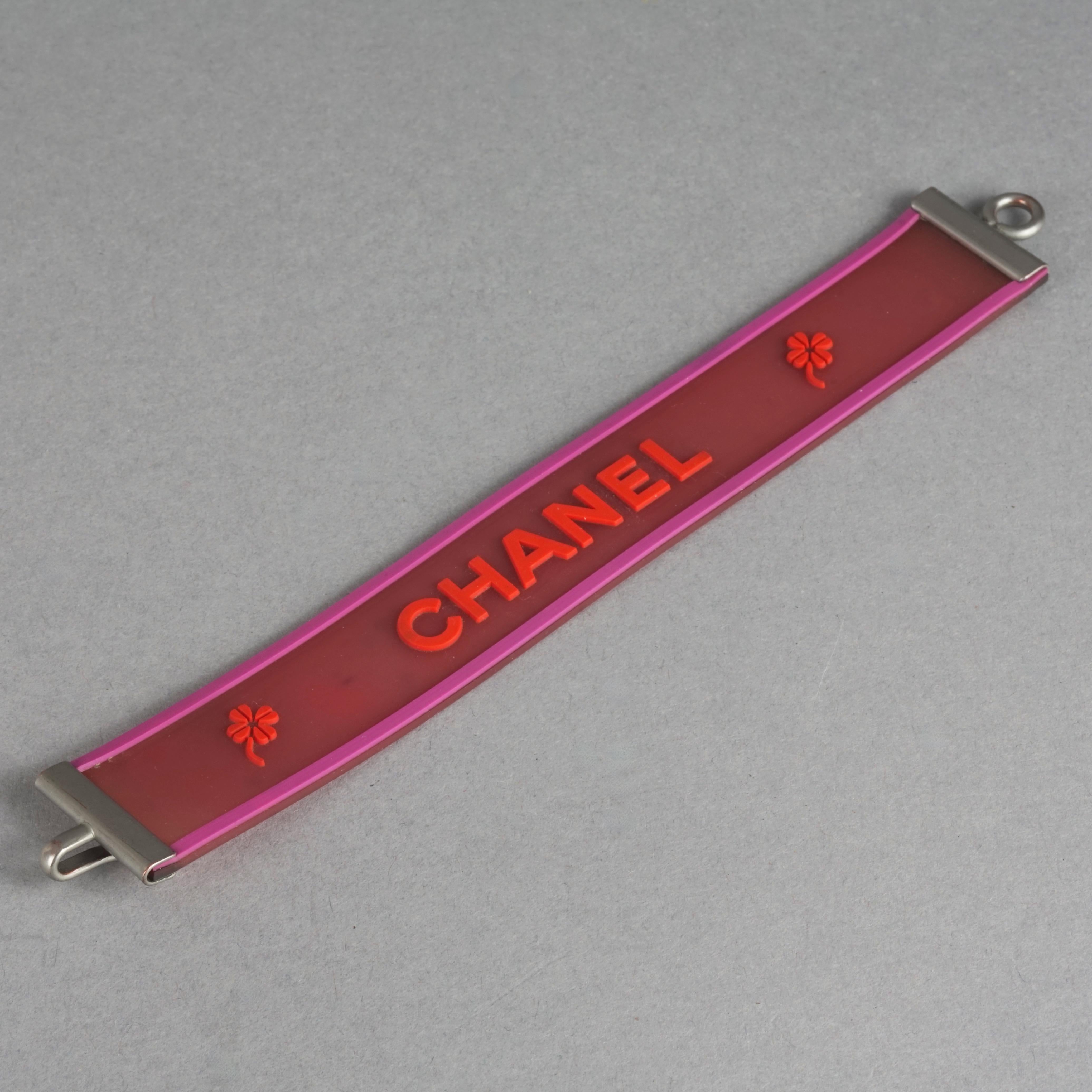 Women's Vintage 2001 CHANEL Logo Camellia Pink Orange Rubber Cuff Bracelet For Sale