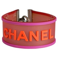 Vintage 2001 CHANEL Logo Camellia Pink Orange Rubber Cuff Bracelet