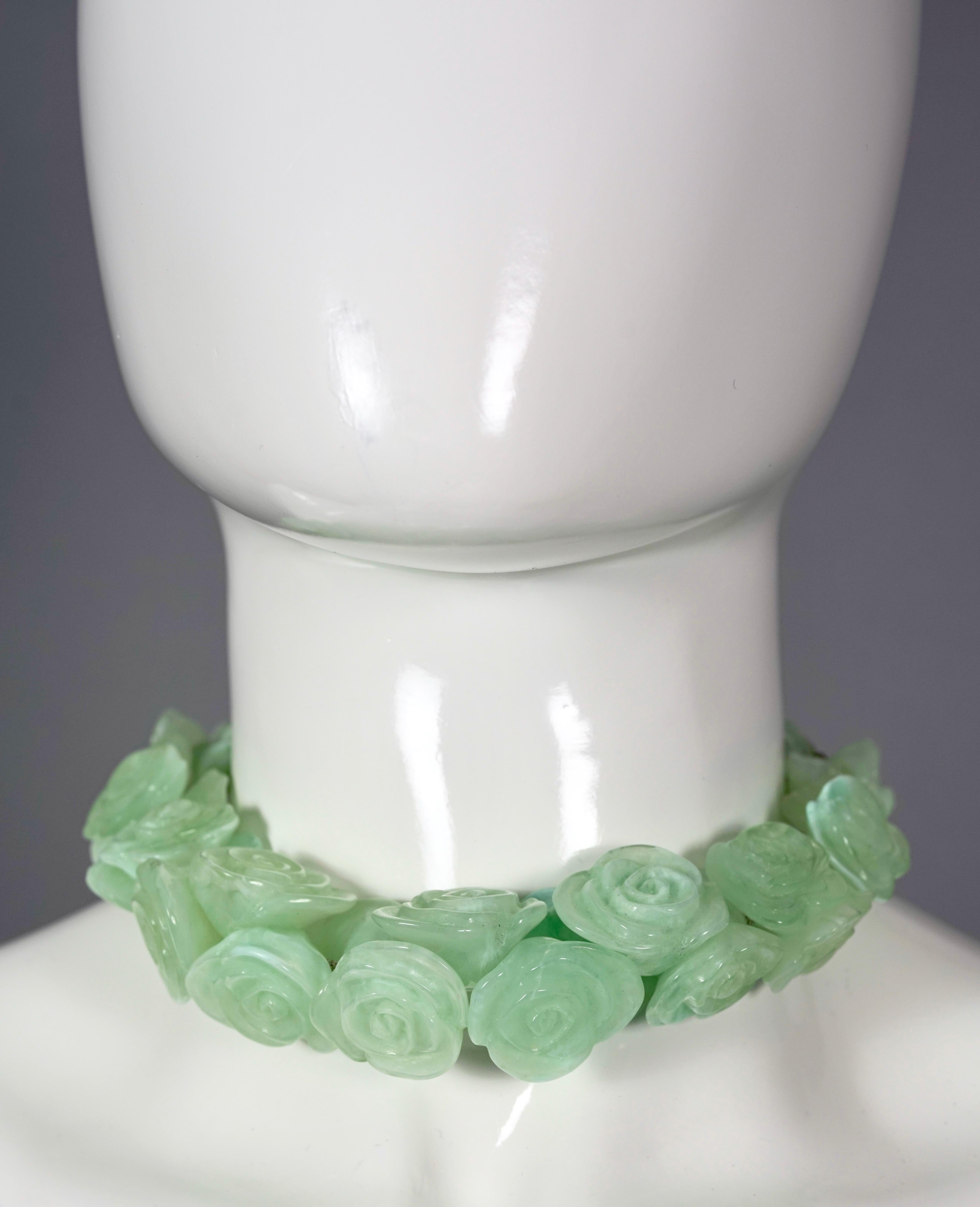 Vintage 2002 CHANEL Logo Camellia Resin Flower Necklace

Measurements:
Large Camellia: 1.25 inches (3.2 cm)
Total Length: 31.49 inches (80 cm)

Features:
- 100% Authentic CHANEL.
- Iconic Chanel camellia resin flowers in green color.
- Random metal