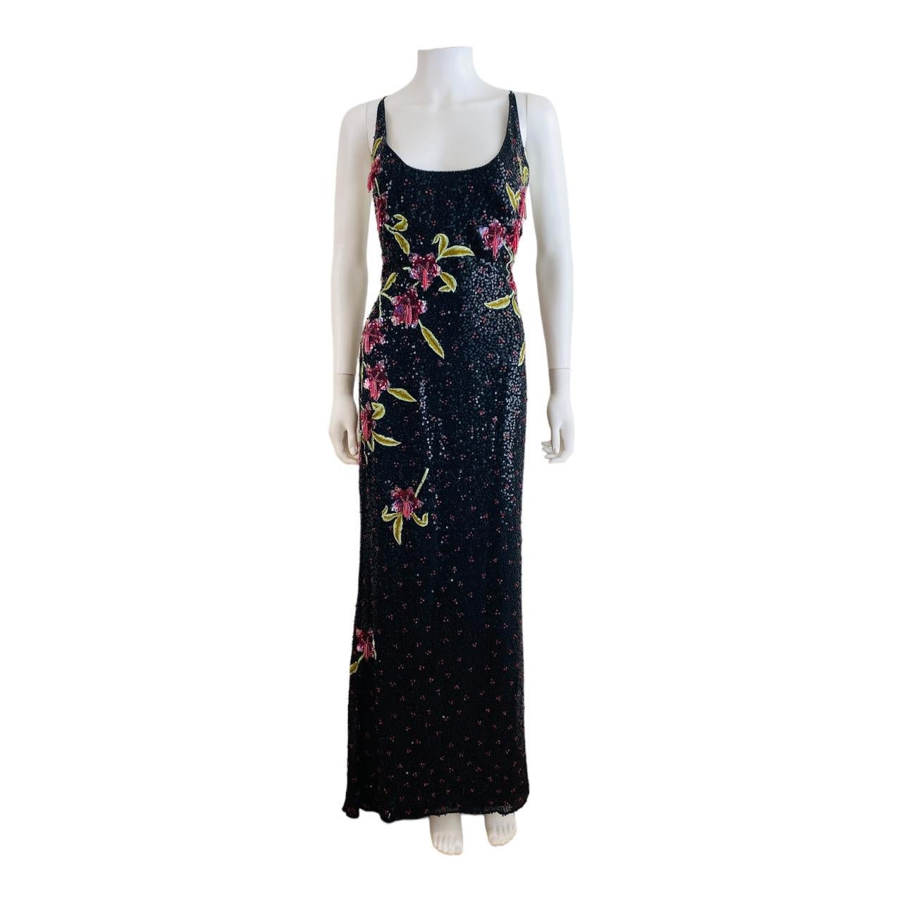 Stunning 2002 Escada dress gown (shown pinned in front picture)
Black silk fabric covered in hand beaded mini black sequins w/embroidered leaves + sequin + beaded flowers throughout
Thin shoulder straps
Scooped neckline
Fitted style
Column style