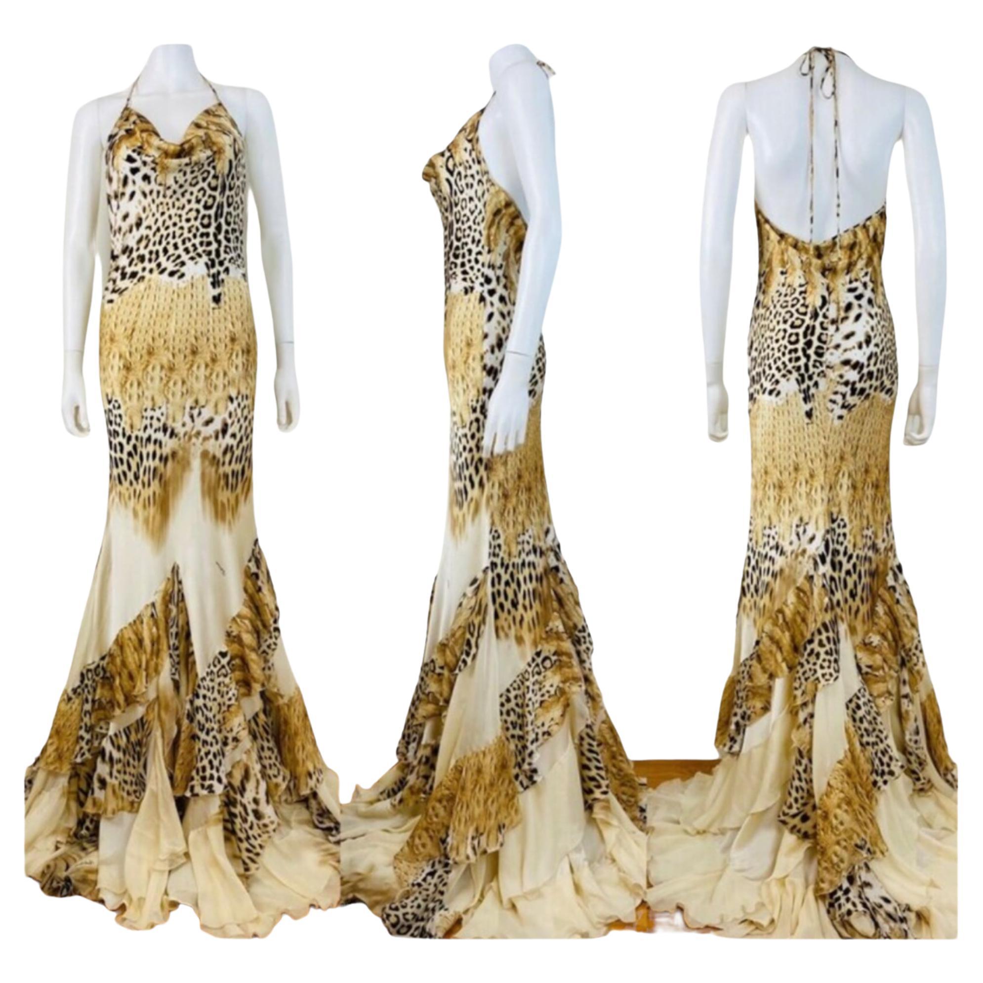 2002 Roberto Cavalli Silk Dress Gown
Cheetah + crocodile print silk fabric
Halter neckline with with long ties
Draped neckline
Fitted bodice
Open upper back
Mermaid hem with ruffled details
Slips on overhead
Unlined

Marked M, Measurements - Bust up