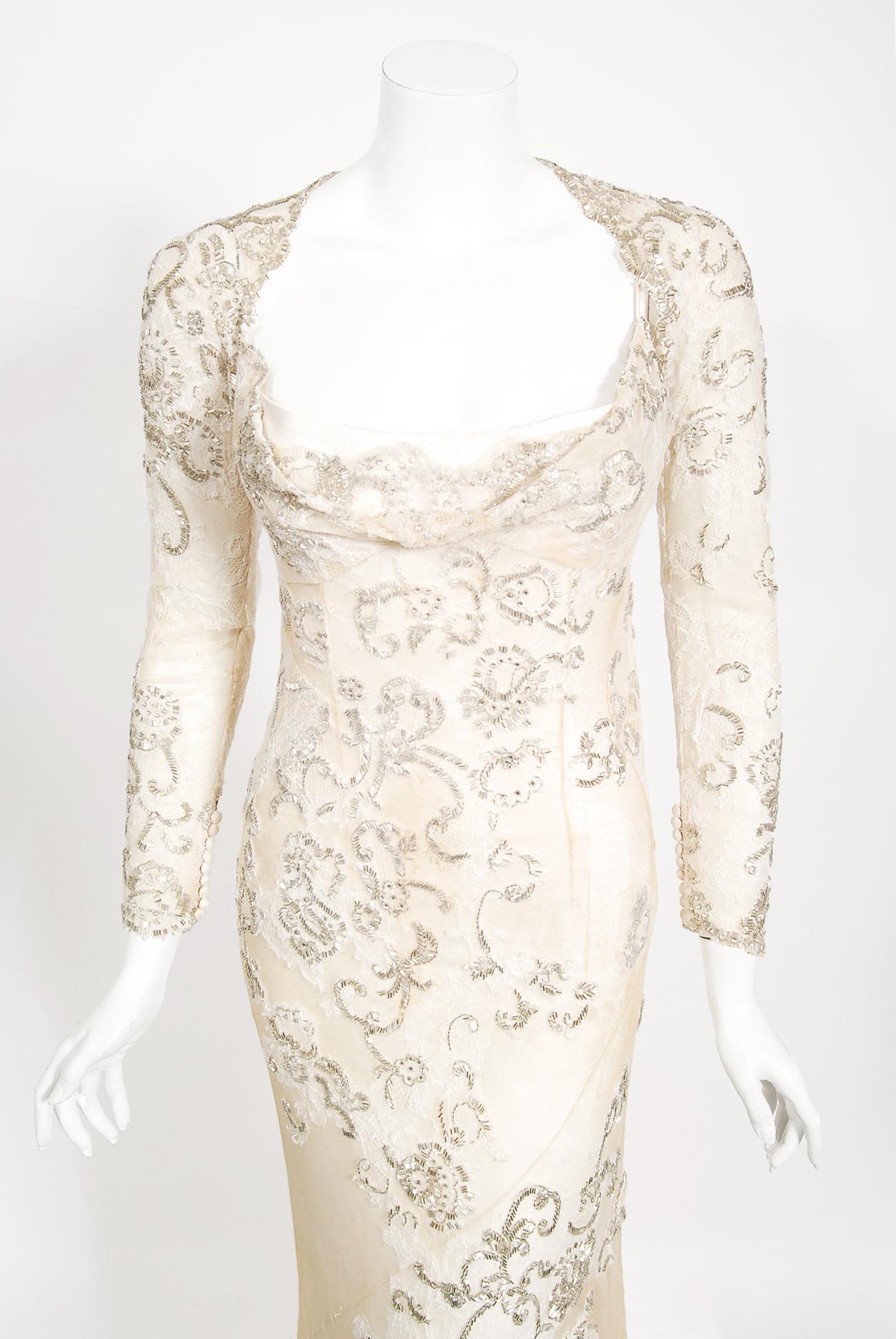 A breathtaking and highly desirable Christian Dior haute couture beaded lace bias-cut trained wedding gown with matching cropped bolero jacket. This incredibly rare numbered Christian Dior treasure from John Galliano's 2003 spring-summer collection