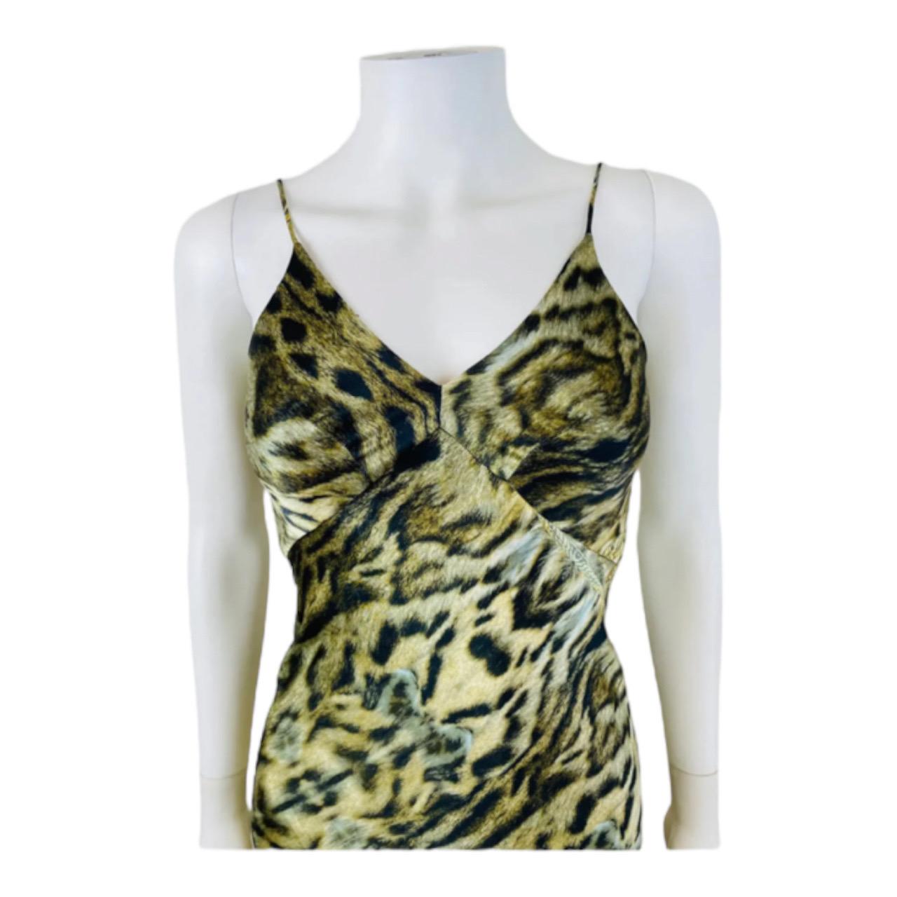 Stunning 2003 Roberto Cavalli Dress
Leopard silk fabric with oversized gold chains print
Fitted bust with V neckline
Thin shoulder straps
Fitted dress throughout with mermaid flared hem
Train in the back
Maxi length
Unlined
Slips on overhead

Marked