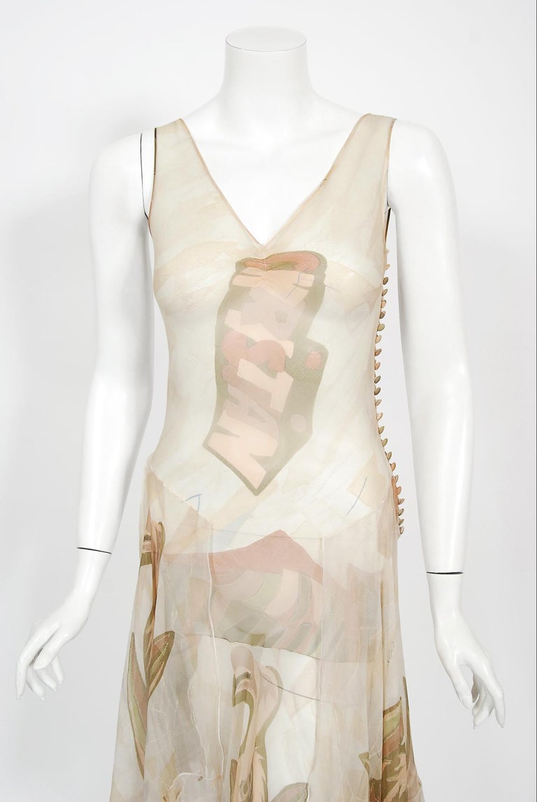 A simply stunning and highly coveted Christian Dior novelty logo pelican bird print sheer silk bias-cut dress. This rare Christian Dior treasure from John Galliano's celebrated 2004 spring-summer collection is a perfect example of his genius. Vogue