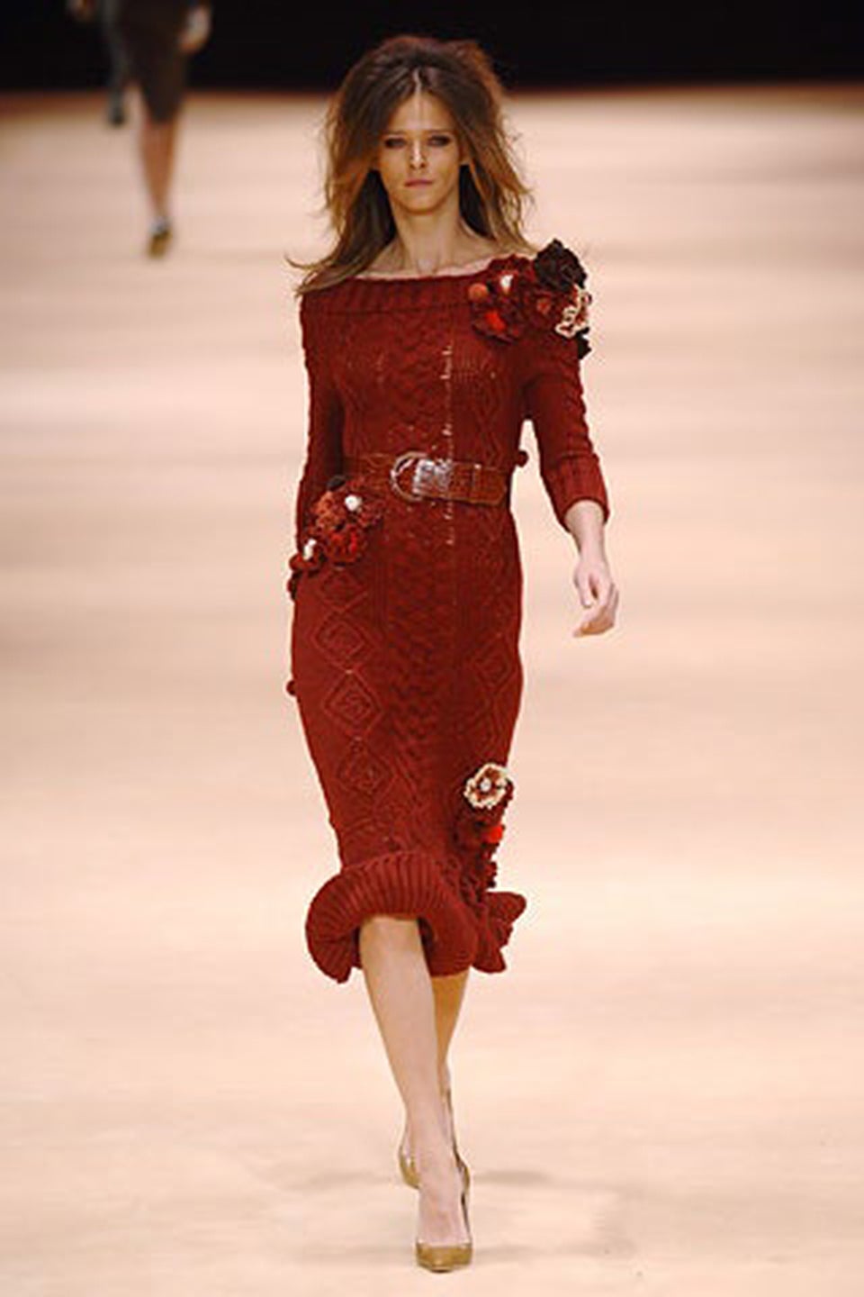 An ultra chic and highly coveted Alexander McQueen lifetime burgundy-red cable knit wool hourglass sweater dress dating back to his beloved 2005 fall-winter collection. As shown, this gorgeous well-documented dress was runway look #2. Vogue stated