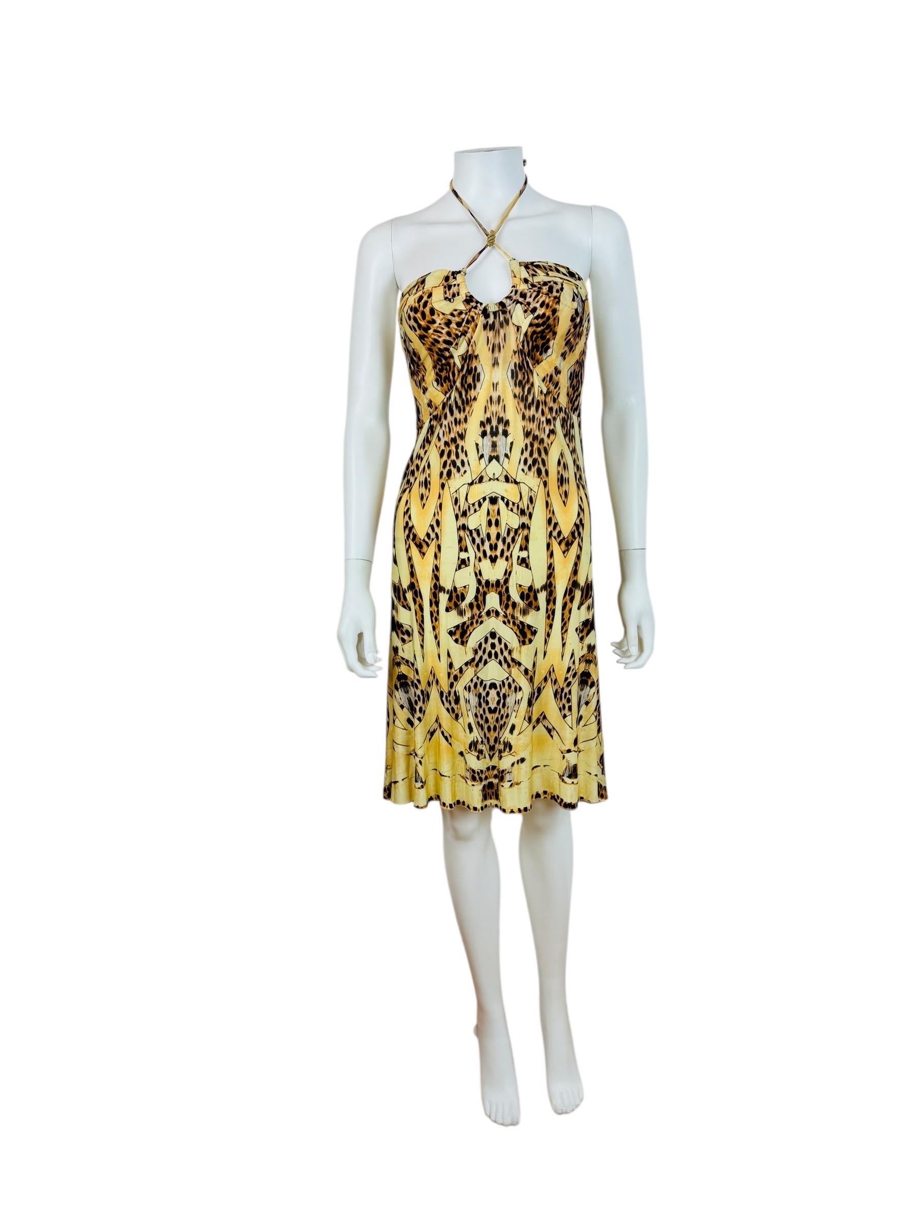 2007 Roberto Cavalli Dress
Abstract animal print cheetah print
Lycra fabric
Halter neckline with thin ties at the neck with gold tone metal snake medallion
Keyhole cut out at the bust with metal detail under the fabric for shaping
Fitted