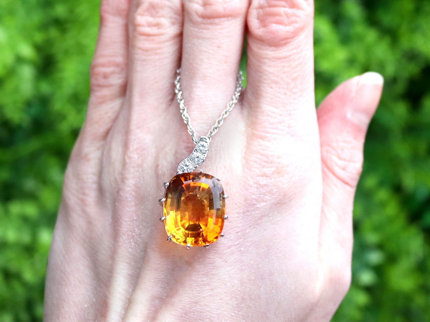 A stunning, fine and impressive vintage 20.12 carat citrine and 0.38 carat diamond, 18 karat yellow gold pendant; part of our diverse gemstone jewellery collections

This stunning, fine and impressive vintage pendant has been crafted in 18k white