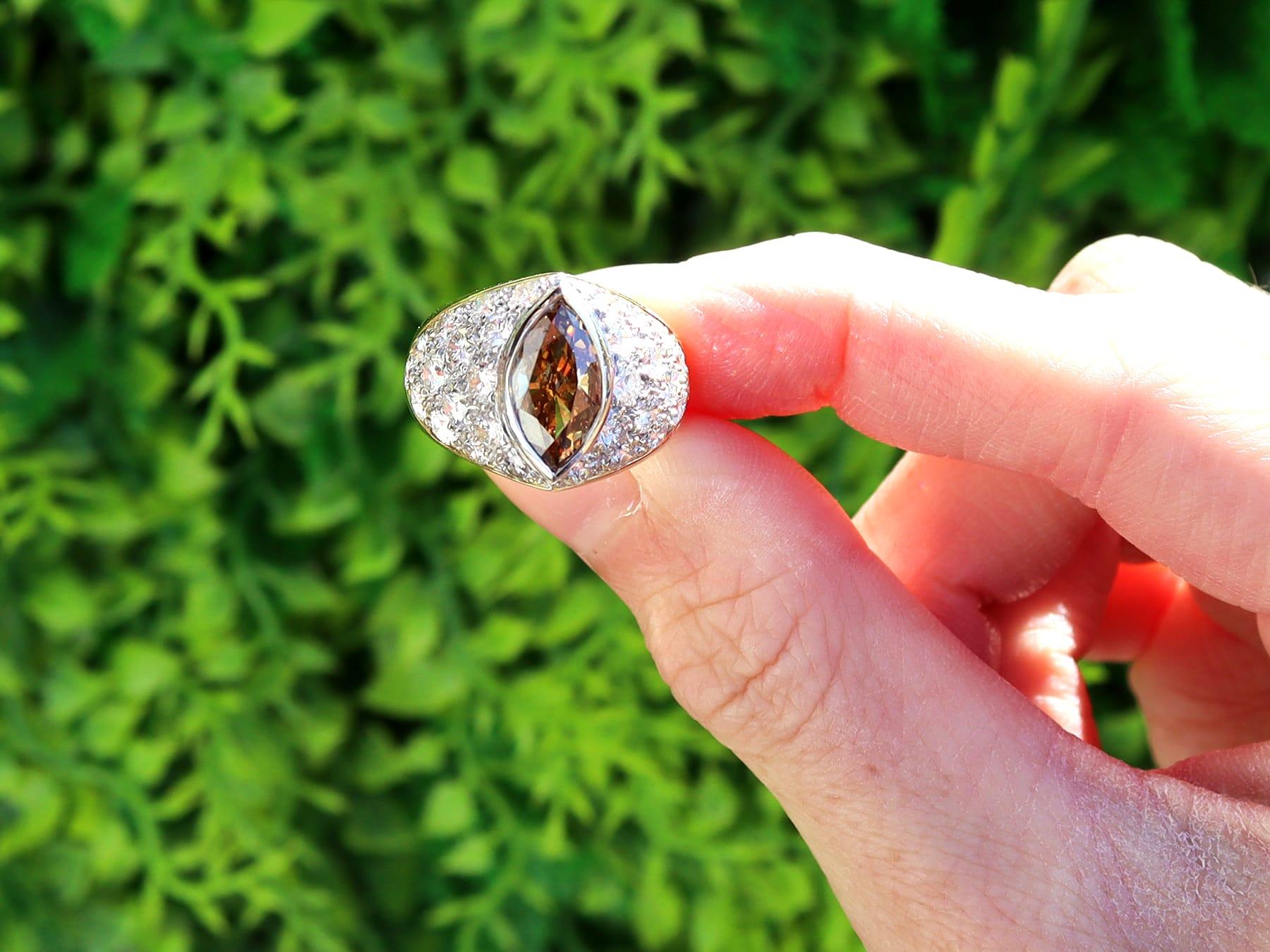 A stunning and impressive, vintage 2.03 carat Marquise cut brown diamond, 3.05 carat diamond and 18k yellow and white gold ring; part of our collection of vintage diamond rings.

This stunning, fine and impressive vintage ring has been crafted in